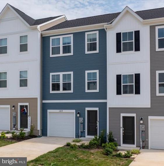 Practically new townhome, one house in from the end of the road.  Very attractive curb appeal with finished lower level and garage.  LVP Flooring throughout and carpet on stairs and bedrooms.  GREAT spacious kitchen with granite countertops, stainless steel appliances, and large island.  Kitchen also has a large pantry across from half bath.  Primary bedroom has large walk in closet and en suite with large walk in shower.  Home is move in ready and easy to show.  Community is very convenient to I-81, Martinsburg City, and shopping areas with all the best shopping and dining in the area.  Multiple tot lots dot the community and there is a community pool that has been planned (but no guarantees on timeframe.  Beat the new construction hustle and call this one home TODAY.