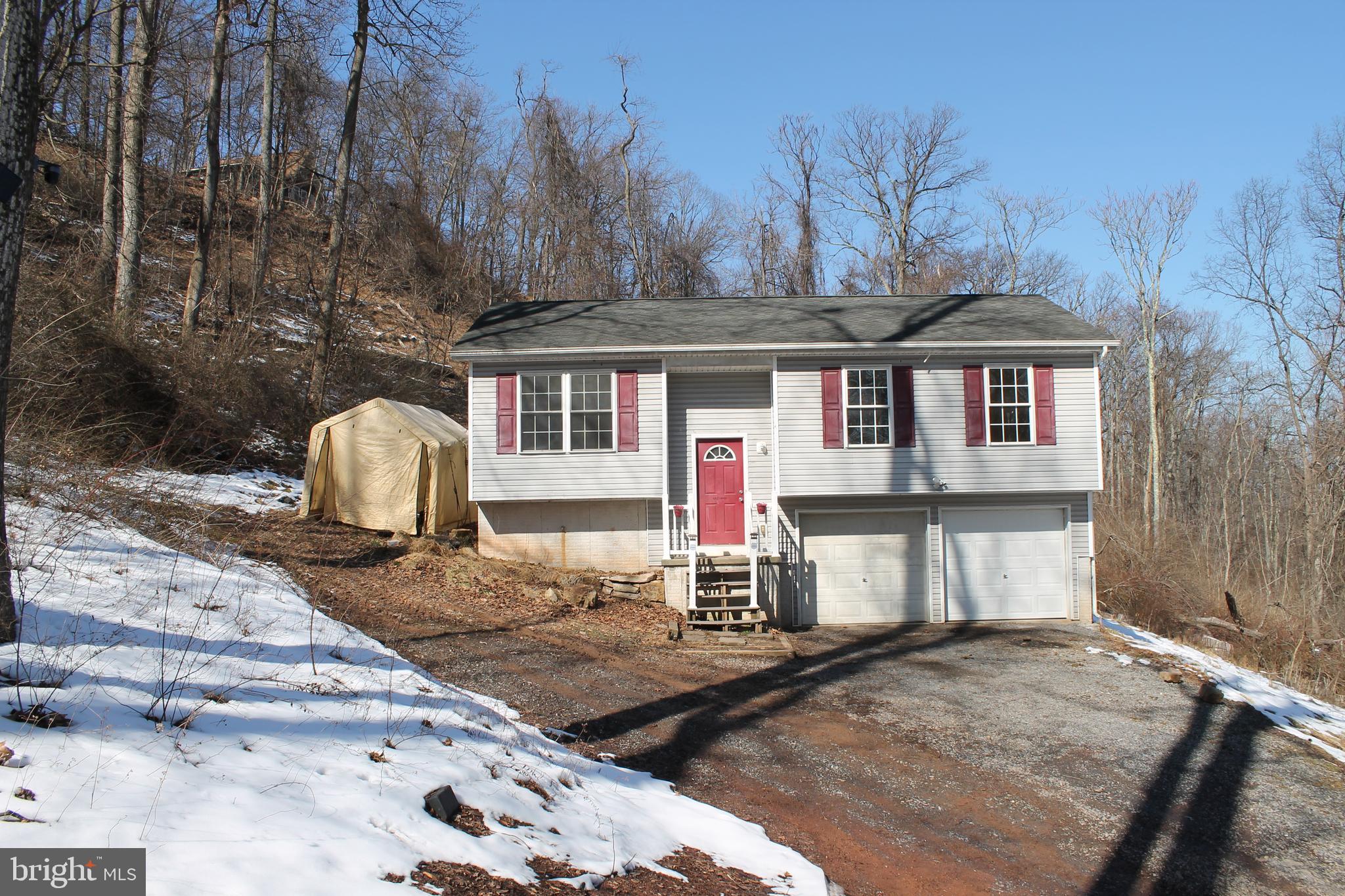 Come check out this great property in Sleepy Creek.  This home offers 3 bedrooms, 2 bathrooms, a finished basement with 2 bonus rooms,  2 car garage all on an unrestricted 1.19 acre lot.   Bring your animals and start a farmette. This property could also be perfect for a short term rental. Sleepy Creek has a beautiful lake with a private beach, dock, baseball field, picnic area, and trail access to some of the best hiking in the area.  The entrance to the Devil's Nose trail is less than 1/8 mile and from the property at the end of Maverick Trail.  Once on the Devil's Nose trail you can access the 250 mile long Tuscarora Trail and the Sleepy Creek Wildlife Management Area (SCWMA).  With nearly 23,000 acres of rugged terrain, SCWMA  is a haven for hunter, anglers and outdoor enthusiasts.