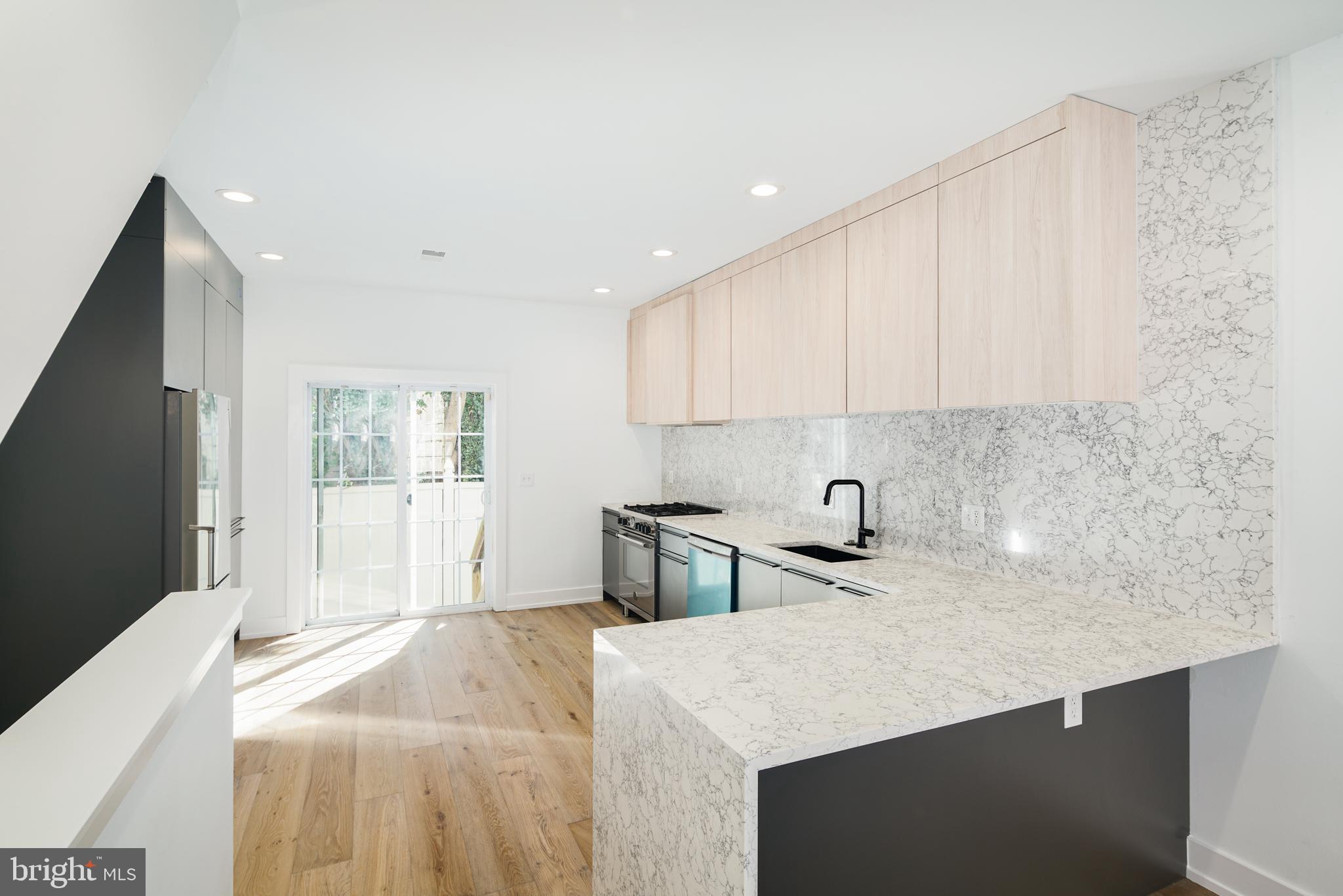Welcome to 1532 Catharine St! A full gut rehab offering plenty of space with 2250 of living space, 3 bedrooms and 2 full bathrooms. This stunning home boasts White Oak Hardwood flooring and immaculate, high-end finishes throughout the bright & open floor plan that will be sure to catch your eye! The fully loaded Kitchen is imported from Spain and boasts plenty of cabinet & counter space, breakfast bar seating, marble back splash and Bertazzoni Appliances, as well as access to a private, fenced-in backyard for easy entertaining. The fully finished basement offers additional living space, a closet for storage, and laundry. The second floor has two generous bedrooms with fantastic natural light, ample closet space and a full hall bathroom. The third floor consists solely of the Master Suite complete with His/Hers custom closets and an ensuite Master bath featuring floor-to-ceiling tile, rain can shower head, matte black finishes, and a large double vanity. Prime Graduate Hospital location with easy access to parks, shopping and restaurants.