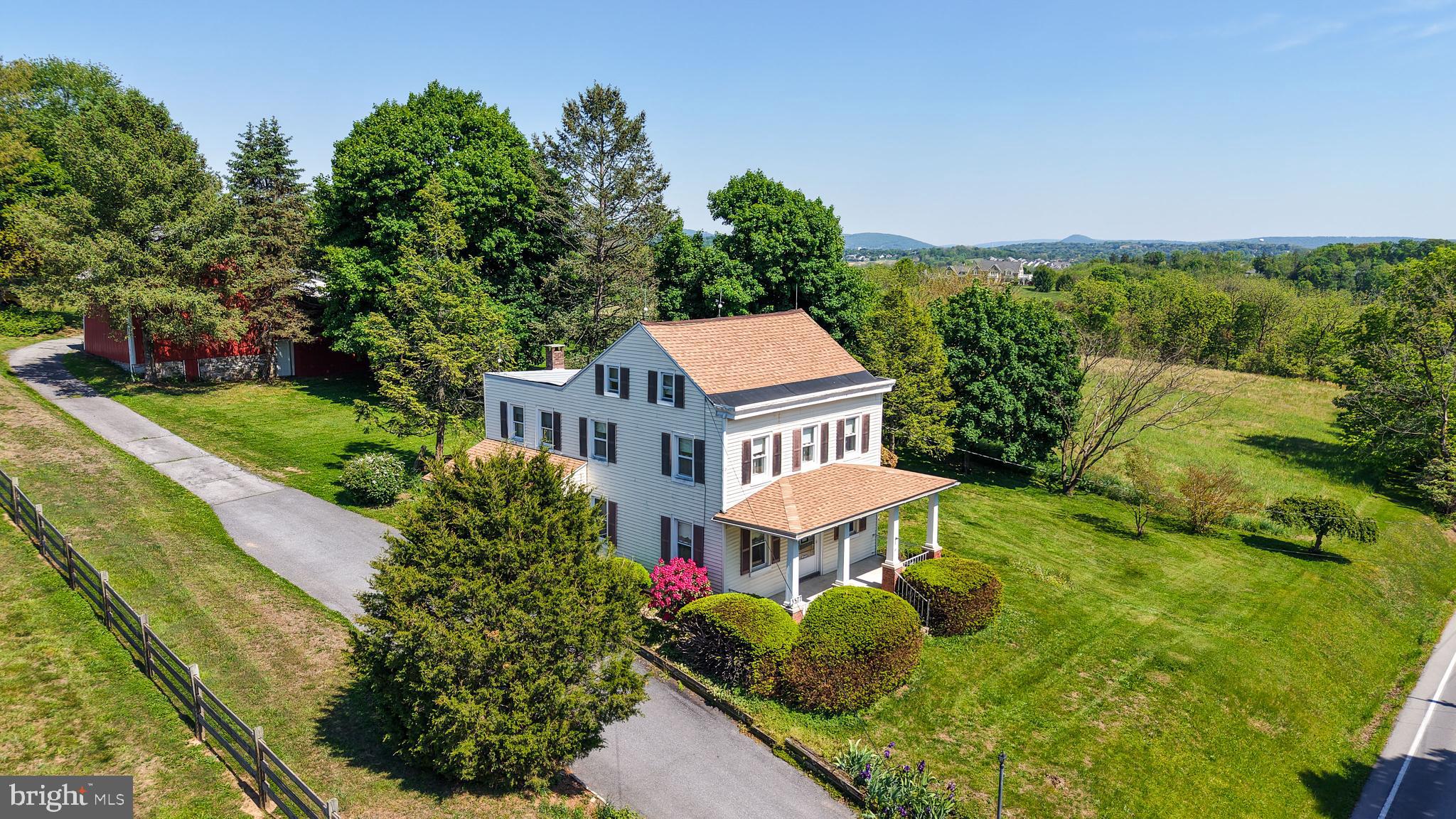 Opportunity awaits with this charming circa 1890 farmhouse nestled on just over 10 picturesque acres in the highly sought-after Wilson School District. Rich with character and surrounded by farmland, this property offers endless potential for the buyer ready to bring new life to a classic country homestead. The main farmhouse features 3 bedrooms, 1.5 bathrooms, and the convenience of main floor laundry. A unique layout adds to the home’s historic charm, including a bedroom with two access points - one directly from the staircase leading up from the first-floor kitchen. While the home is in need of some TLC and updating, the main components of the home are in excellent working order and provides a solid foundation for restoration, renovation, or customization to suit your vision. Outside, the property truly shines with an impressive collection of outbuildings offering flexibility for storage, hobbies, agriculture, workshops, or future creative use. These include a two-story summerhouse with 3 rooms, a block house, pump house, pole barn, cold cellar, and detached garage. This rare property combines rural tranquility with valuable acreage in a desirable location. Whether you are seeking a homestead, hobby farm, horse farm, or a peaceful country retreat, this property is brimming with possibilities! Since the property is not currently in the clean & green, there are no roll back taxes if the new owner chooses to subdivide.  Call today to schedule your private showing of this truly unique parcel!