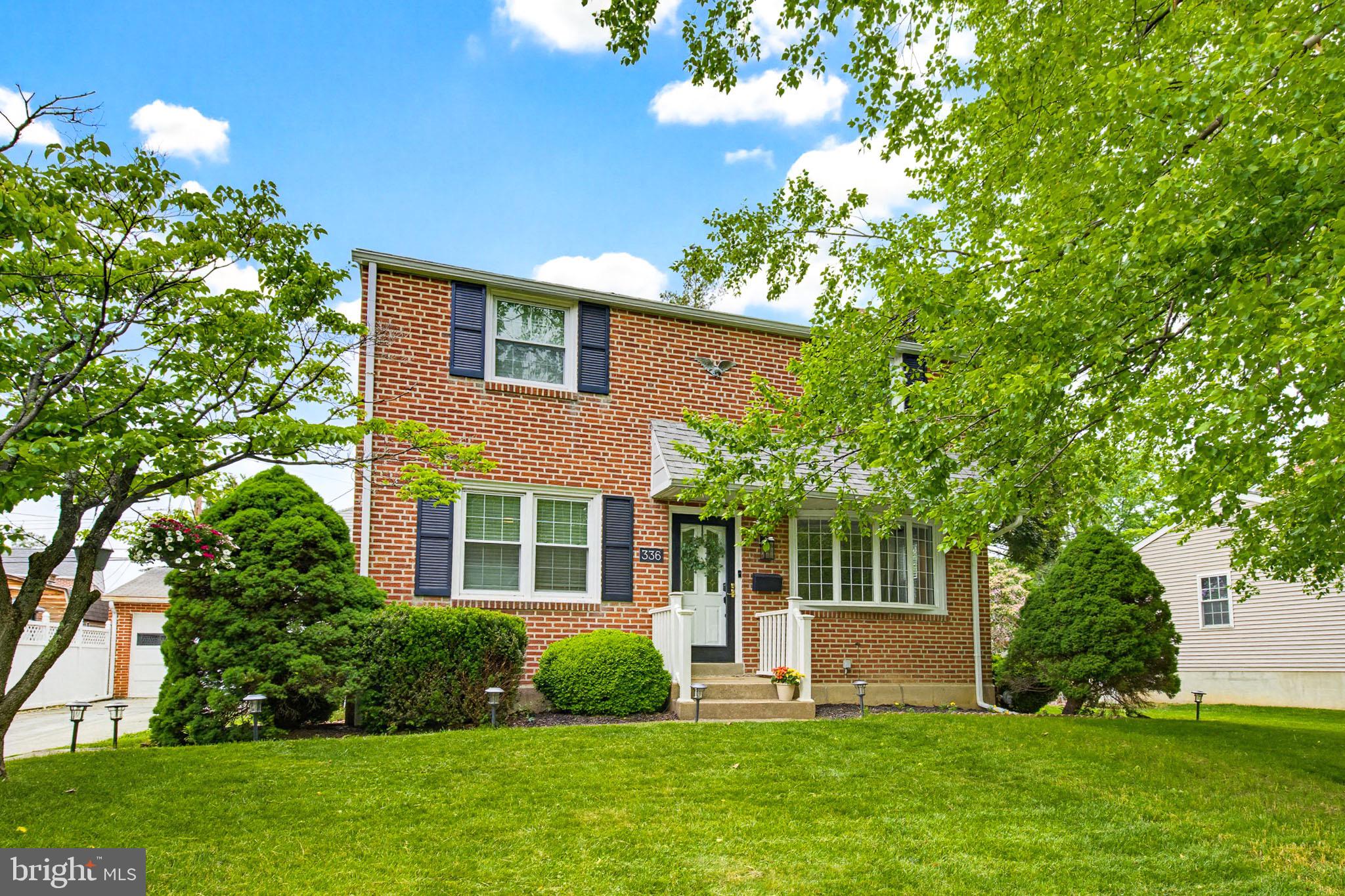Welcome to 336 Yarnall Drive, a beautifully maintained 3-bedroom, 1.5-bath brick home where timeless charm meets stylish modern updates. From the moment you step inside, you'll appreciate the gleaming hardwood floors and the abundance of natural light that fills every room, creating a warm and inviting atmosphere throughout.

At the heart of the home is the renovated kitchen, thoughtfully designed with quartz countertops, stainless steel appliances, a center island with bar seating, and a classic subway tile backsplash. The open layout flows seamlessly into the dining area and spacious living room, where a cozy gas fireplace creates the perfect setting for relaxing evenings or entertaining guests.

Just beyond the main living space, the sunroom offers the ideal spot to enjoy your morning coffee, unwind with a good book, or host friends throughout much of the year. Step directly outside to the patio, overlooking the flat backyard—perfect for outdoor dining, gardening, or simply enjoying the peaceful setting.

The upper level features three comfortable bedrooms, including a generously sized primary bedroom with an oversized walk-in closet, while the finished lower level provides even more living space with its own vintage-style bar and convenient half bath, making it an ideal recreation room, game room, or entertaining space.

Additional highlights include a detached one-car brick garage, durable brick exterior, and numerous major system updates, including a new roof (2019), HVAC system (2021), and hot water heater (2016), providing added peace of mind for years to come.

Ideally located near shopping, dining, parks, schools, and major commuter routes, this move-in-ready home offers the perfect blend of character, comfort, and modern convenience. Don't miss your opportunity to make 336 Yarnall Drive your next home!