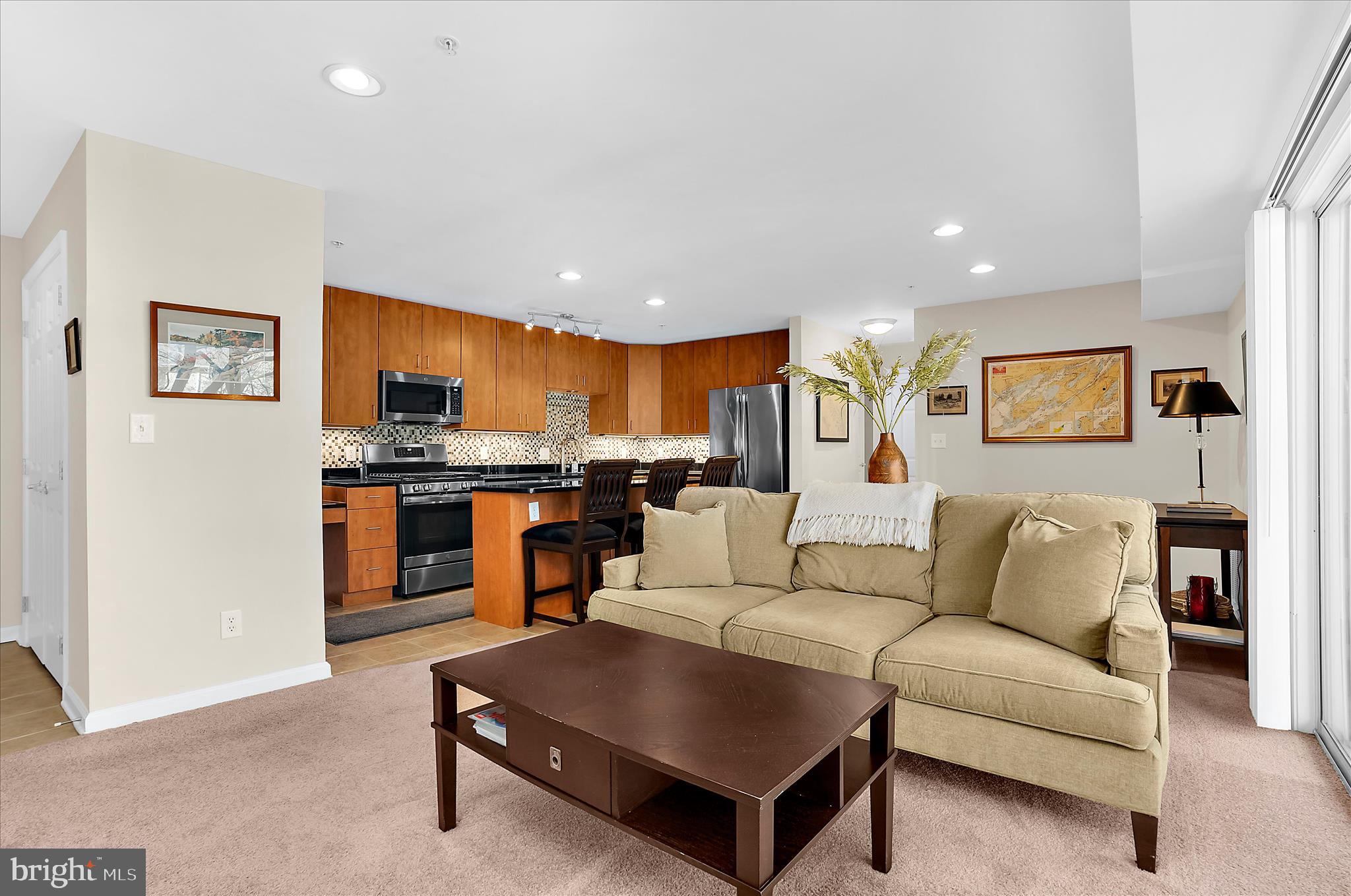 Price Improvement! Welcome to 1113 Primrose Court #204 in the ultra convenient community of The Landing at Spa Creek! Step into a recently refreshed building with secure keypad entry and head up to this spacious second floor, 2 bedroom, 1 bath condo. Inside, you’ll be delighted by the light filled living room and open floor plan, perfect for everyday living and entertaining. The updated kitchen features a large island, stylish backsplash, and stainless steel appliances, with plenty of room for a dining area. Just off the living room, enjoy your private balcony, an ideal spot for morning coffee or evening relaxation. The primary bedroom offers generous space and ample closet storage, while the second bedroom works beautifully for guests, a home office, or flex space. A tastefully updated hall bathroom serves the home. Storage is easy with a coat closet, two additional hall closets, and a dedicated storage locker in the building's basement. Parking is simple with an assigned space conveniently located near the unit, plus guest parking on the side of the building. The HVAC system was replaced approximately two years ago, and water and gas are included in the condo fee. Residents of The Landing at Spa Creek enjoy fantastic amenities, including a community pool, clubhouse, fitness center, and a public boat ramp at the end of Primrose Drive. The location is hard to beat, walkable to Truxtun Park, tennis and pickleball courts, and the Pip Moyer Recreation Center, and just a short bike ride to historic downtown Annapolis. Commuting is easy with quick access to USNA, NSA Annapolis, Fort Meade, Baltimore, Washington D.C., and BWI Airport. Schedule your showing today and experience easy Annapolis living!