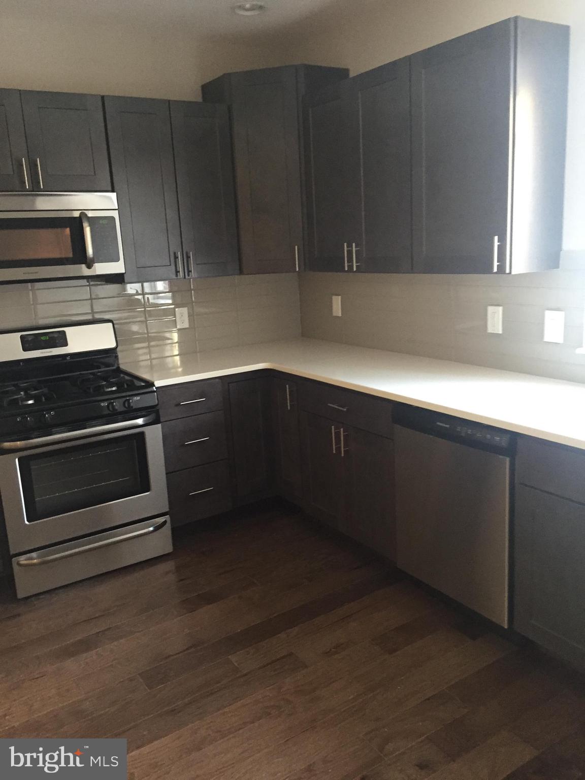 This is a first floor two large bedrooms with adjoin baths, eat in kitchen with European kitchens cabinets, quartz countertop, glass back splash, stainless appliances, living room and dining room, washer and dryer, hardwood floors throughout, recessed lighting and central air.