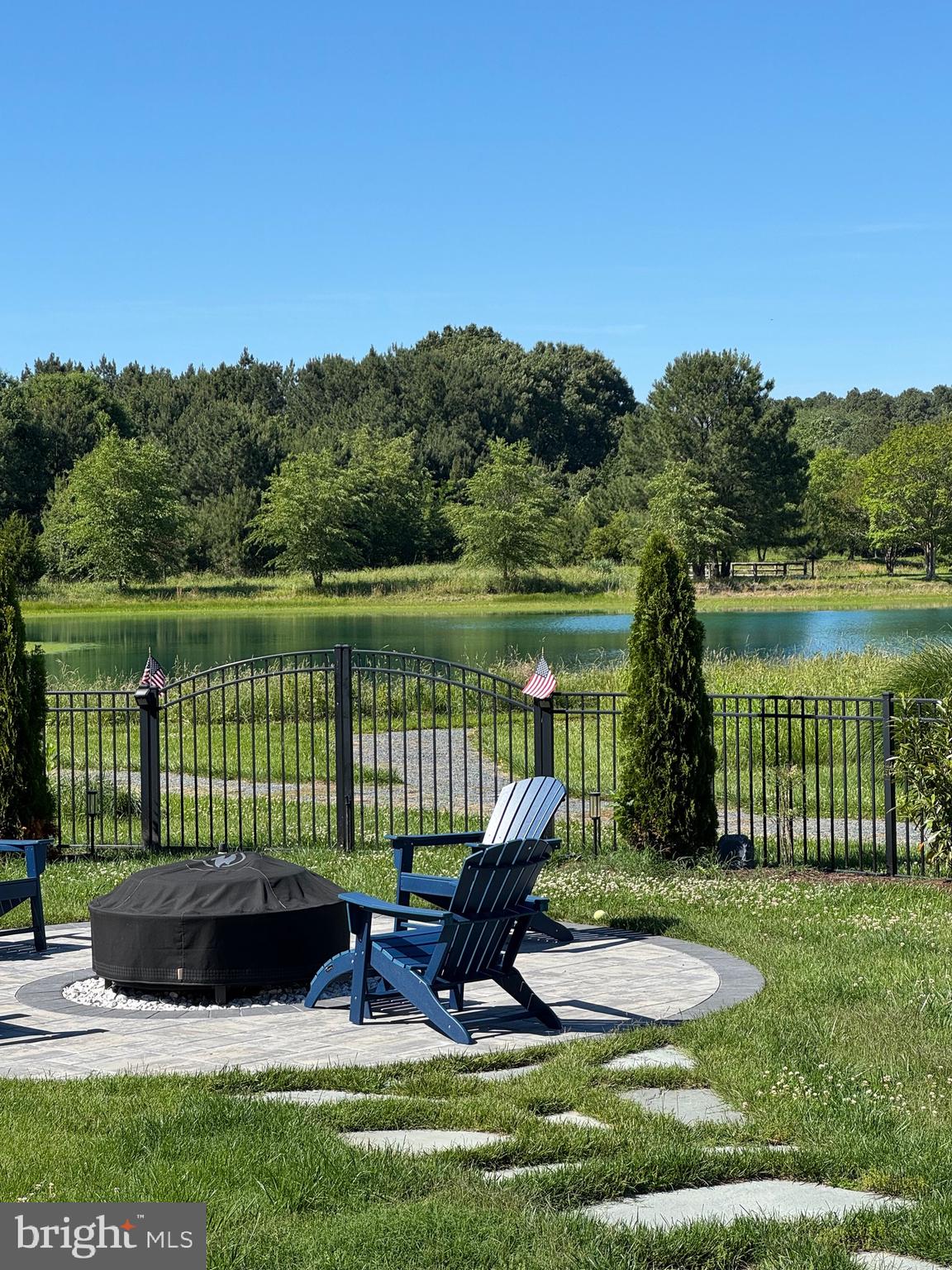 Welcome to 24896 Back Creek Drive Saint Michaels, a coastal home with one of the most beautiful back yard pond  views available in the entire community! 
This property has so much a buyer may desire--modern, coastal design, open concept living, soaring ceilings, a large fenced back yard, broad views of a beautiful pond, water access approx 0.2 miles down the community pathway to San Domingo Creek for kayaking/paddleboarding, an abundance of space, a kitchen with a spectacular gas stove and two ovens, a gas fireplace, recently planted privacy trees, an encapsulated crawl space and so much more!
You will be the envy of family and/or friends as you all sit around the enormous 90" flat screen television over the fireplace to take in sporting events or shows  (television conveys with the property) or when you sit around the new hardscape fire pit boasting a new, large pellet/wood burning stove (which also conveys, along with the four new Adirondack chairs)! If you prefer to take in the spectacular water view from the nice deck or the large four season sunroom, either is an excellent option!
The primary suite is on the main floor with all other bedrooms upstairs. There is an option to have an upstairs primary en suite if you prefer being on the same floor as other bedrooms.
This property has sold in past listed as a five bedroom property so is listed as such again. Please be advised two of the five bedrooms do not have closets; wardrobes have been used in past listing of the property. Closets can easily be built in those two bedrooms--there is tremendous space to do so. 
Recent seller upgrades include a newly paved driveway, fire pit hardscape and pellet/wood fire pit (which conveys with the sale of the property),  kitchen cabinet handles/pulls, entire exterior of the home was power washed, The crawl space is encapsulated.
This property is very close to  a grocery store, coffee place, bank and gas station. St Michaels' Historic District can be reached in mere minutes by car or on foot. The Y, community pool, Miles River Yacht Club, Chesapeake Bay Maritime Museum, Inn at Perry Cabin, golf,  are all in proximity.