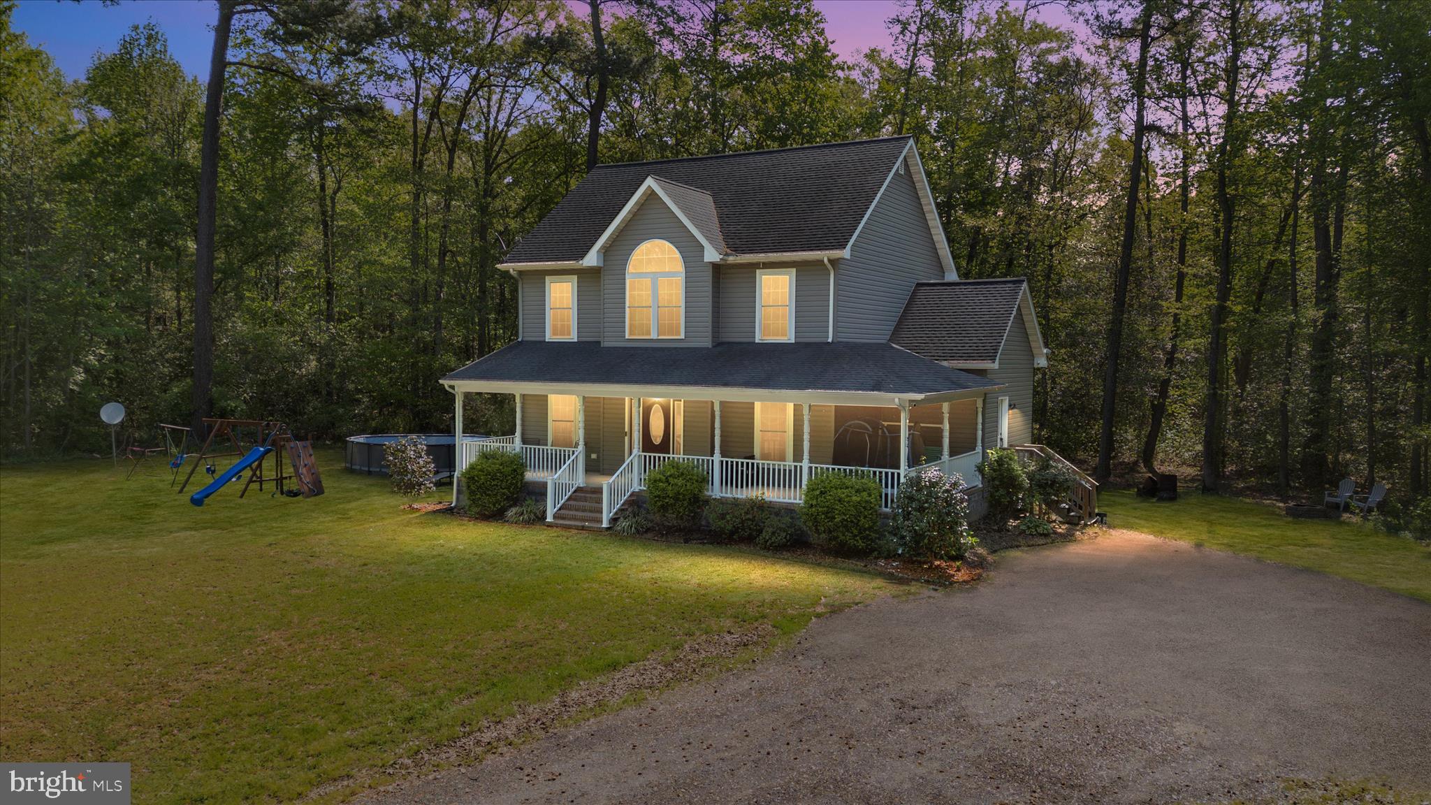 Come and enjoy this private countryside retreat just outside of Hurlock on Maryland’s beautiful Eastern Shore.
Situated on over 2 acres, this secluded property is surrounded by mature trees, offering exceptional privacy and a peaceful, natural setting. Tucked back from the road, you’ll immediately appreciate the quiet atmosphere and room to spread out.
The main level offers a thoughtful and versatile layout, featuring a half bathroom great for guest, that is right next to the mudroom/laundry room off of the rear door entry. A well thought out open concept formal living room off of the kitchen, a a spacious formal dining room to host gatherings, and a comfortable casual family room ideal for everyday living. The open-concept kitchen equipped with all stainless steel appliances and a large gas range flows seamlessly into the family room that has an option to install a gas fireplace with the existing hookup already in place, creating the perfect space for gathering and entertaining. The kitchen also includes a dedicated dining area and seating space with stools at the counter— ideal for casual meals, morning coffee, or hosting guests.
Upstairs, you’ll find three bedrooms, along with two full bathrooms. A loft area on the second level provides flexible additional living space — perfect for a home office, reading area, or secondary lounge. A convenient half bathroom is located on the main level for guests. The primary bedroom walk-in shower was just recently renovated (May 2026) with all new tiling and an added rain-head shower head for a spa feeling. 
Enjoy peaceful mornings and relaxing evenings on the inviting front porch, where you can take in the serene surroundings. A separate storage shed offers added convenience for lawn equipment, tools, or hobbies.
With expansive acreage for room to expand, wooded privacy, and well-appointed living spaces, this property offers the perfect blend of comfort, functionality, and Eastern Shore charm.
