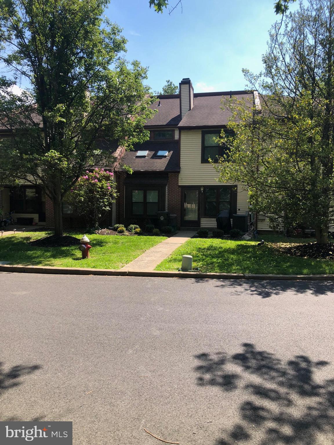 Property has undergone a complete renovation and ready to move in.
Very affordable townhouse living in Newtown and short walk to Historic S. State street shops, restaurants and activities.  LOW TAXES,  LOW ASSOCIATION DUES,  LOW UTILITY AND MAINTENANCE COST.  Community has swimming pool, tennis court, basketball court, and playground.  Home is an outside unit where parking is easy access in front of property.  Enclosed front porch entry vestibule for additional storage and shelter from weather on entering home. Living room w/woodburning fireplace and bookshelves.  Dining area has vaulted ceiling with skylights and large window with box seat.  Main second floor bedroom has walk in closet and separate closet.  Entire interior has undergone an upgrade with  new paint throughout, new flooring on first floor and carpet on 2nd floor and bedrooms, brand new quartz countertop kitchen with all appliances and breakfast bar,  remodeled powder room and bathroom.  Major items have been replaced: windows 2022 (except vestibule and 2 small 2nd floor windows), roof 2015, HVAC and hot water 2017.  Outside has brand new landscaping.  Range, microwave and dishwasher are brand new.  Refrigerator, washer and dryer have been replaced but are not brand new.  Home is in move in condition.  Great location in the community and just off Newtown bypass that connects to I-95. Seller is a licensed PA realtor.