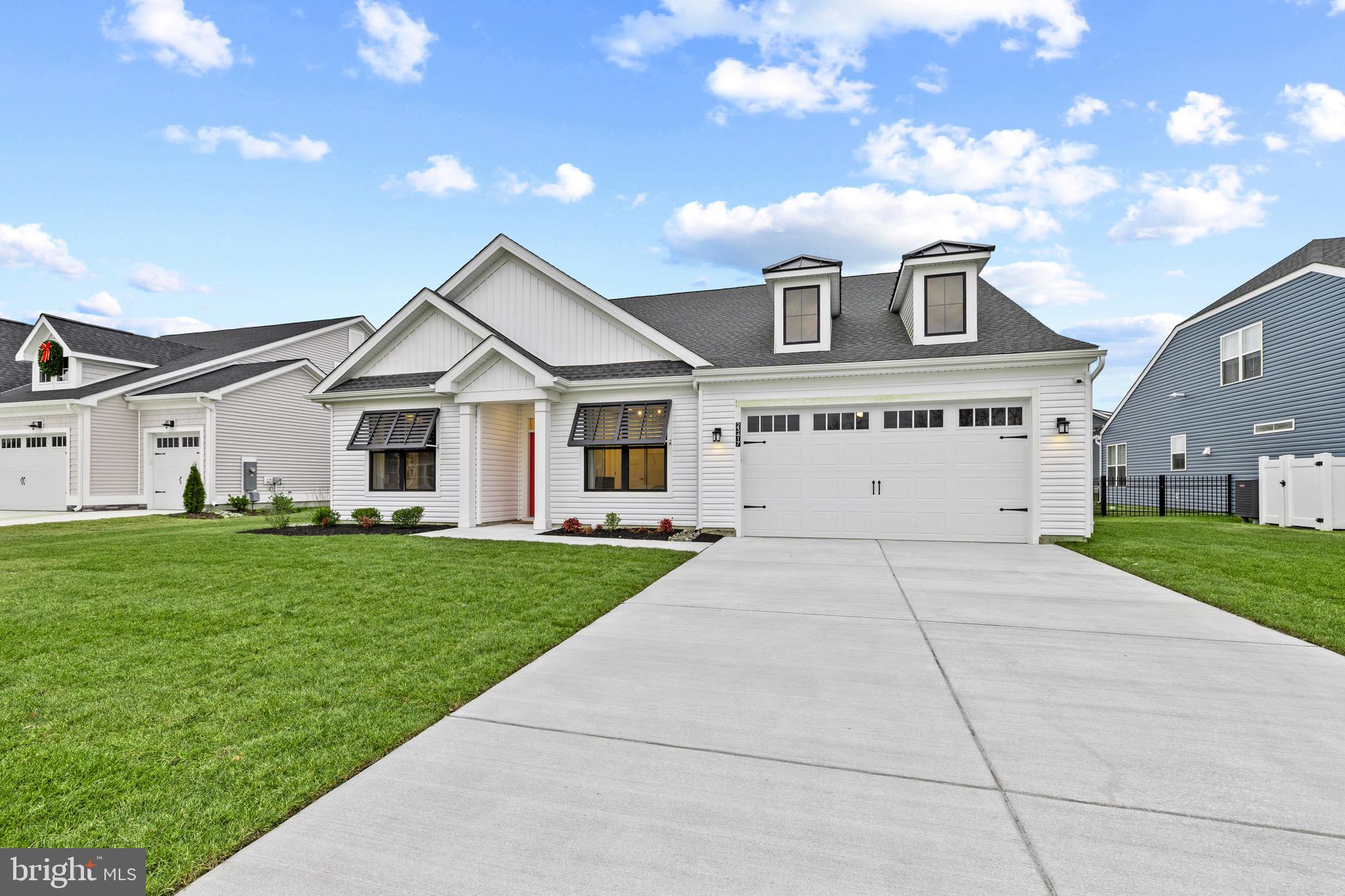 This stunning former model home, located in the premier East Gate community, offers refined coastal style and exceptional finishes throughout. 23417 E Gate Dr features 4 bedrooms and 4 full bathrooms, with 3 of the 4 bedrooms offering ensuite baths, and over 3,200 square feet of superior craftsmanship, thoughtful design, and premium finishes rarely found in standard builds.
From the moment you arrive, the home impresses with classic coastal curb appeal, highlighted by architectural rooflines, dormer windows, and a welcoming covered front porch. Inside, the foyer sets the tone with wainscoting, tray ceiling detail, and wide-plank hardwood flooring that flows throughout the entire first floor and loft area.
The expansive open-concept main living area is ideal for entertaining, seamlessly connecting the living space, dining area, and gourmet kitchen. The kitchen showcases upgraded cabinetry, a large center island, modern pendant lighting, stainless steel appliances, a wall oven with built-in microwave, and abundant counter space—designed for both beauty and functionality.
The owner’s suite is a true retreat, featuring custom woodwork, a tray ceiling, and a spacious walk-in closet. The ensuite bath offers a large walk-in shower, upgraded ceramic tile, and dual vanities. Just off the bath, the custom-built walk-in closet provides direct access to the laundry room for added convenience.
Upstairs, you’ll find an expansive loft, a large bedroom with ensuite bath, and easy access to a generous storage area that can easily be converted into a fifth bedroom or home office.
Outdoor living is a must at the beach, and this home delivers with a screened-in porch featuring a double-sided fireplace, leading to a paver patio overlooking the pond—the perfect setting for relaxing or entertaining.
A rare opportunity to own a true showcase home—inside and out. Schedule your appointment today!
