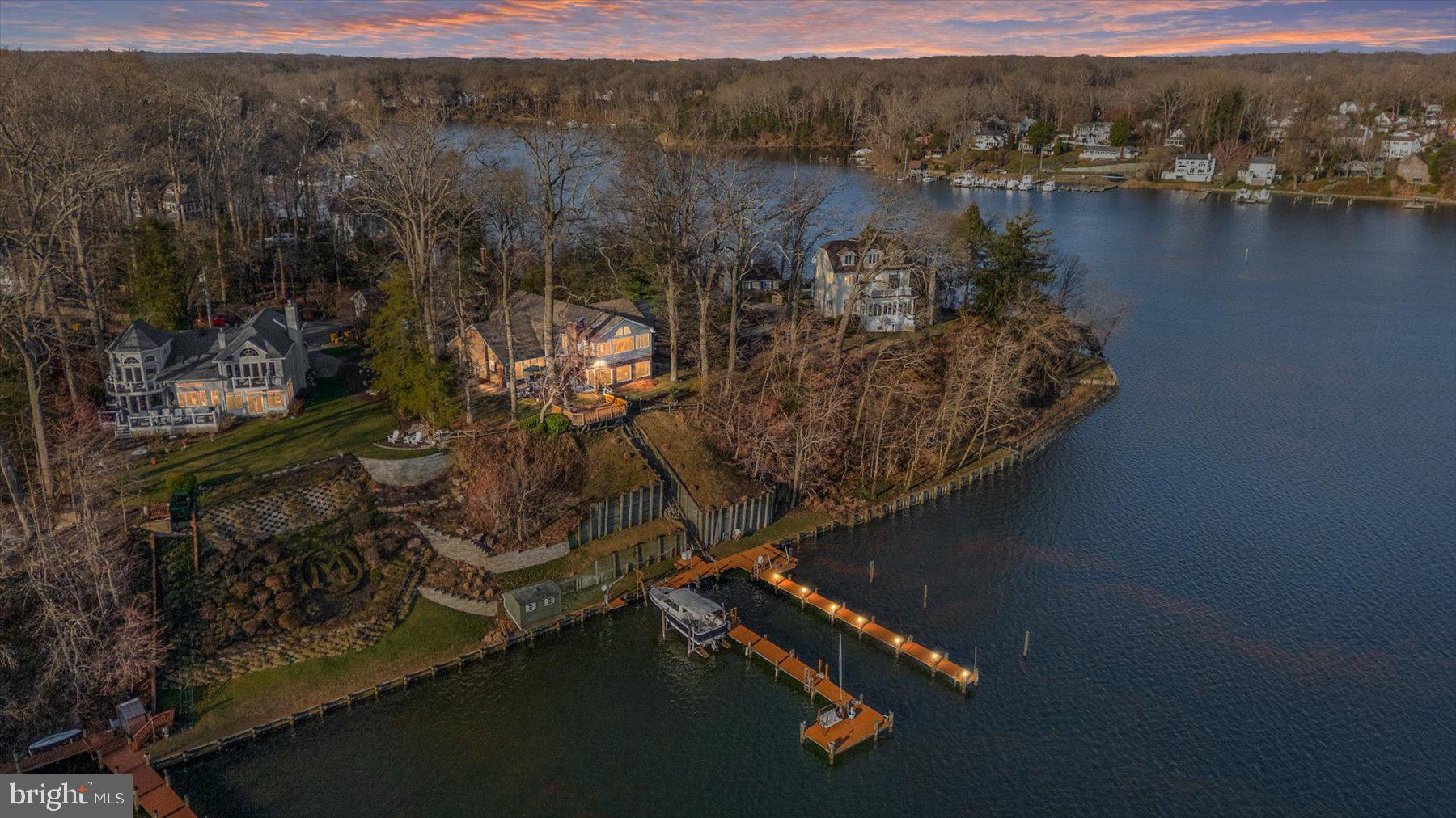 Waterfront Living at Its Finest in Edgewater Beach!

Welcome to this exceptional waterfront home located in the sought-after community of Edgewater Beach. Perfectly positioned along the South River, this property offers breathtaking panoramic water views and the ultimate Chesapeake Bay lifestyle.

Designed with flexibility in mind, this spacious home features 5 bedrooms and 4.5 bathrooms, including two main-level bedrooms with en suite baths—ideal for convenient one-level living or accommodating guests. One of these main‑floor bedrooms opens directly onto a private waterfront patio, creating a serene indoor‑outdoor retreat.

The expansive family room is filled with natural light and showcases stunning water views along with a cozy gas fireplace, creating the perfect space to relax or entertain. At the heart of the home, the large kitchen offers abundant space, a double pantry, and endless potential to customize and create your dream culinary space.  A centrally located office/bonus room adds a quiet, light‑filled workspace complemented by a calming water view.

Upstairs, the impressive primary suite is a true retreat, featuring an en suite bath, pellet stove, private exterior entrance, and incredible sunrise and sunset views through numerous windows. Two additional upper‑level bedrooms with an adjoining  balcony offer elevated vantage points to enjoy the surrounding beauty. A full bath completes the upper level.

Step outside onto the patio & deck overlooking the river—perfect for morning coffee or evening gatherings. A tram provides easy access down to the waterfront, where you’ll find two expansive 85-foot piers with deep water slips and three boat lifts, making this property a boater’s dream.

Additional features include a detached two‑car garage, whole‑house generator, Pella windows, and a fully fenced yard—everything you need to enjoy effortless waterfront living.

This is a rare opportunity to own a premier South River property with unmatched views, space, and potential.