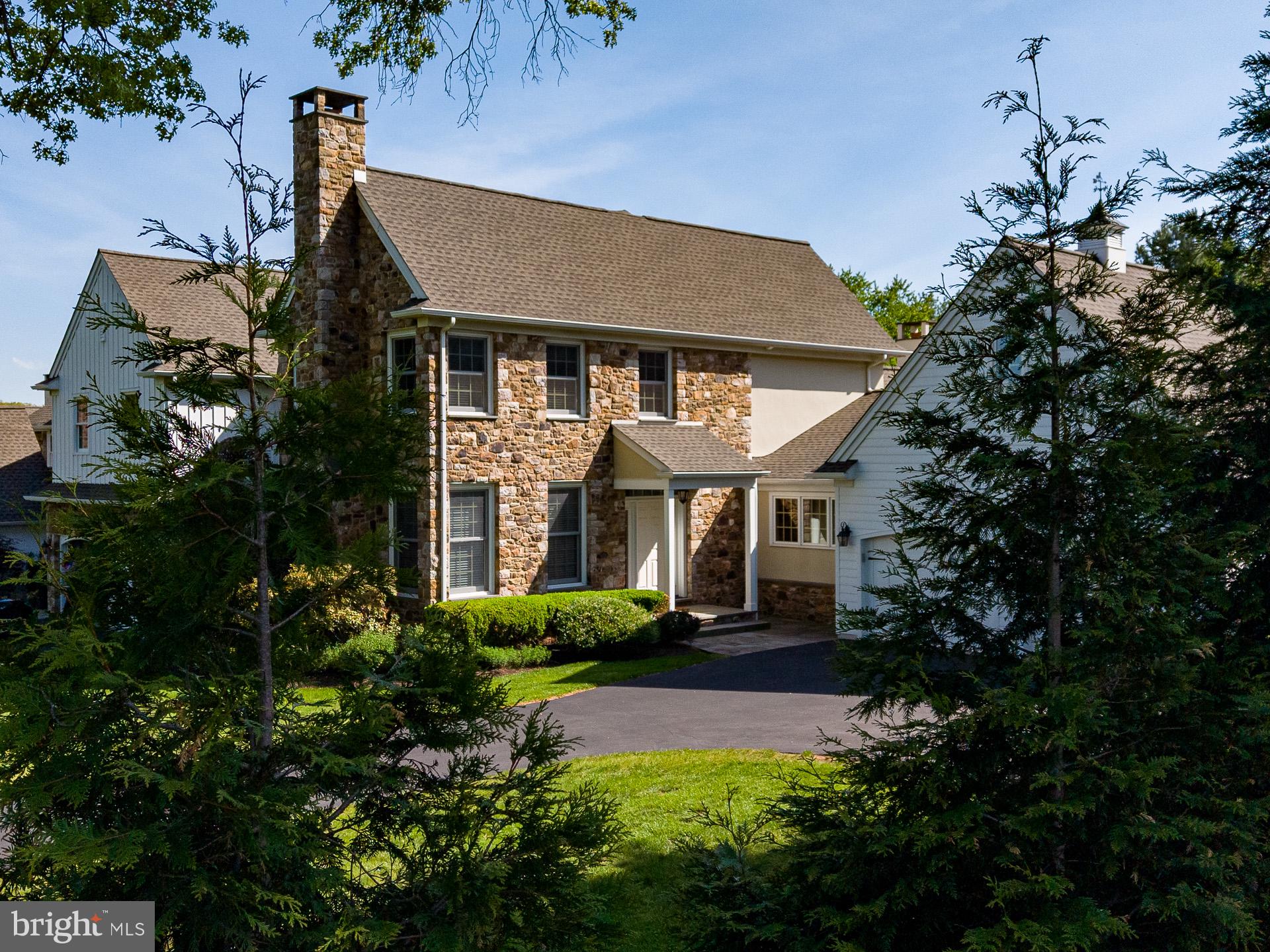 Private. Rare. Extraordinary. Welcome to Garden Path, a private luxury condominium community in the heart of Bucks
County. Step through the stone framed covered porch into a soaring two-story foyer. To your left, a sitting room with a
French-style gas fireplace and large windows. Straight ahead, a spacious formal dining room that comfortably seats a
party of eight or more. To your right, a striking dark stained oak staircase ascending to the second floor.

From the foyer, flow into the elegant kitchen featuring custom cabinetry, premium granite countertops, a contrasting
center island, and a divider island with cabinet pillars and wine chiller. A breakfast nook provides the perfect spot for
morning conversations, while glass sliding doors open directly to a private stone paved deck. This outdoor space
showcases wrought iron fencing, a luxurious auto-retractable awning, and gas-ready hookup for your barbecue grill on
those beautiful spring and summer evenings.

From the kitchen, step into a sun-drenched living room anchored by a dramatic floor-to-ceiling stone gas fireplace,
soaring vaulted ceilings, and hand-hewn barn beams that create an undeniably comfortable and luxurious experience.
The first-floor primary suite is a true masterpiece, with a stunning bathroom featuring dedicated his and hers vanity
sinks, a freestanding clawfoot tub on rich marble floors with gold fixtures, and a spacious walk-in glass enclosed
shower. An extended walk-in closet with custom organization provides ample space, while double doors open from the
bedroom to a private stone patio garden, creating a serene personal retreat.

Completing the first floor is a dedicated laundry room with washer and dryer just off the kitchen, a beautifully appointed
guest half-bathroom, and an attached 2-car garage accessible directly from the laundry room, making grocery runs
and weather transitions effortless.
Upstairs, two generously sized bedrooms each feature luxurious en suite bathrooms. The second bedroom includes
an alcove tub, walk-in shower, and double vanity sink. The third bedroom offers a walk-in shower and vanity sink, filled
with natural light.
The fully finished lower level is a standout. Open and bright with recessed lighting and luxury vinyl plank flooring in
Marsh Oak throughout, it provides flexibility as a home office, recreation space, or guest area, complete with its own
full bathroom. A stunning, private library wrapped floor-to-ceiling in dark stained custom built-ins is a room that stops
people in their tracks.

Throughout the home, you will also find hardwood flooring, crown molding, built-in whole home audio systems, a water
softening system, a fully automated sprinkler system, and architectural details that reflect the meticulous care taken in
its construction.

With exterior maintenance handled by the HOA, your time goes to the things you love most. Beyond the gates, a
walking path leads directly into Doylestown Borough, one of Bucks County's most beloved towns. Stroll to acclaimed
restaurants, boutique shops, Fonthill Castle, Mercer Museum, and more. Commuters will appreciate the proximity to
the train station, Doylestown Hospital, and the Bucks County Courthouse, with Philadelphia just one hour away, New
York two, and the Jersey Shore an easy 90-minute drive.

This is not a home you stumble upon. This is a home you've been waiting for.

2GARDENPATH.COM