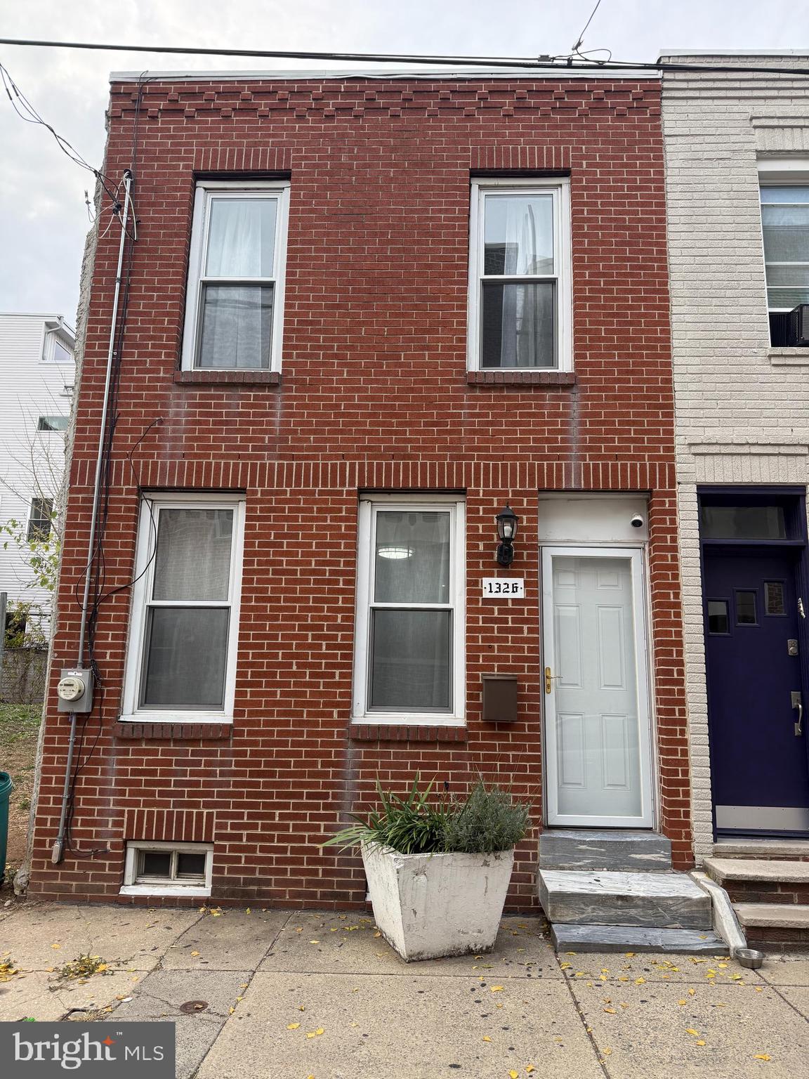 Welcome to this beautifully renovated 2-bedroom, 1-bath home on one of Point Breeze’s most desirable and quiet streets. Step inside to discover a bright, open-concept living and dining area that flows effortlessly into a modern chef’s kitchen featuring stainless steel appliances, generous counter space, and ample storage. The private rear patio is ideal for grilling, entertaining guests, or simply relaxing outdoors. Upstairs, two spacious bedrooms easily accommodate king-sized beds. The primary bedroom includes custom built-in IKEA cabinetry, providing stylish and functional storage. The clean, finished basement offers abundant additional storage space and a dedicated laundry area. Surrounded by new construction and recently updated homes, this block highlights Point Breeze’s strong community spirit and continued growth—making it both a smart investment and a truly welcoming place to call home. Enjoy exceptional convenience with nearby access to Target, Sprouts, Giant, CVS, Aldi, PetSmart, Starbucks, the Italian Market, and East Passyunk’s popular restaurants and boutiques. Rittenhouse Square and Center City are just a short stroll away. With SEPTA Route 2 at your doorstep, the Broad Street Line only three blocks away, and unmetered parking available, city living has never been easier.