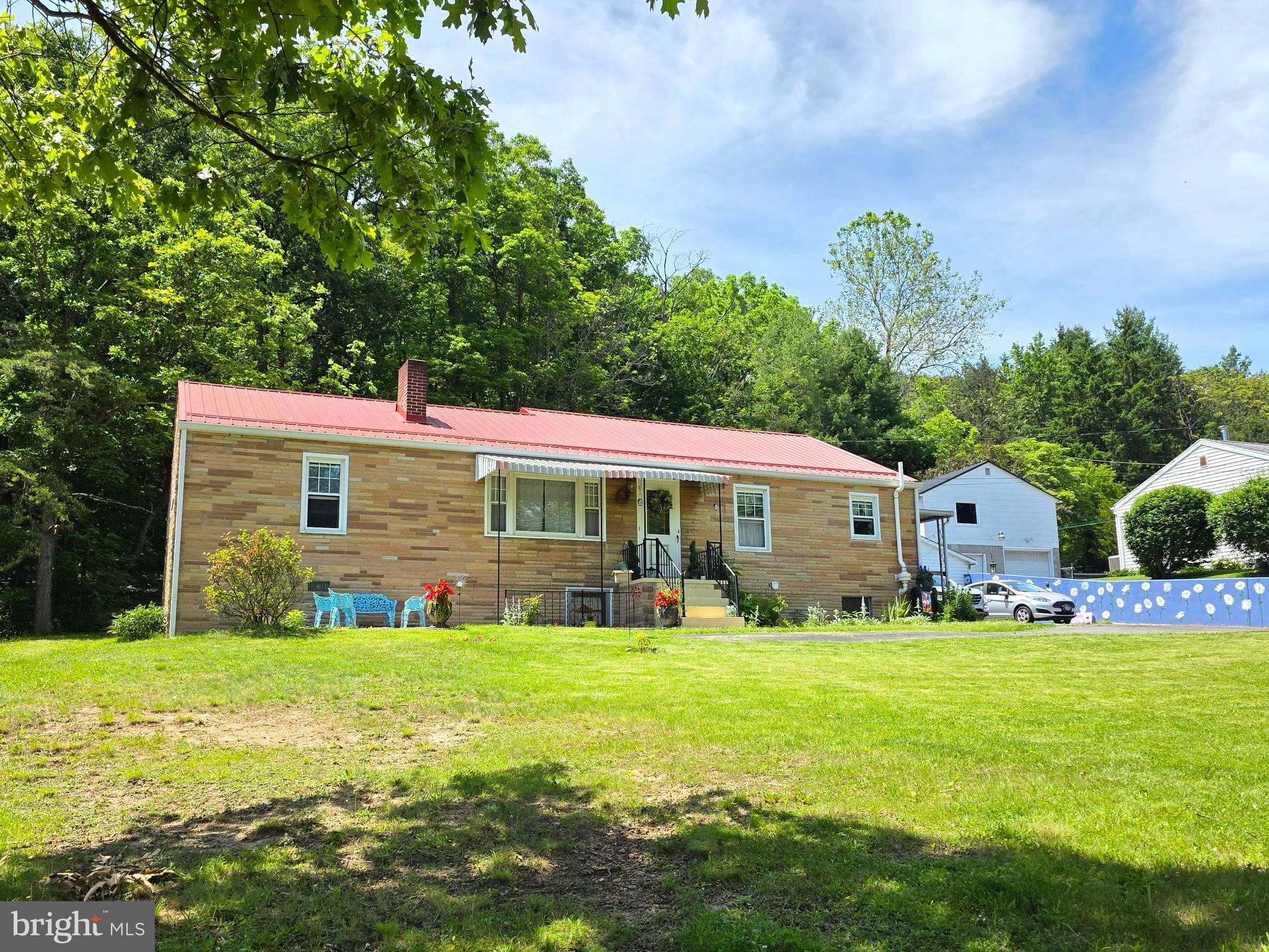 Classic Stone Rancher on 1.02 Acres — Space, Comfort, and Convenience Await! Welcome to 5046 Frankfort Highway in Ridgeley, West Virginia—a beautifully maintained stone rancher offering timeless curb appeal, generous living space, and a wonderful setting on approximately 1.02 acres. This inviting home features 4 bedrooms and 2 full bathrooms, providing plenty of room for family, guests, or a home office. Inside, you will appreciate the spacious living room and separate family room, offering flexibility for entertaining, relaxing, or gathering around the cozy wood-burning insert on cooler evenings. The comfortable eat-in kitchen provides table space for everyday meals and morning coffee, while all appliances convey, including the washer and dryer, helping make your move even easier. The full unfinished basement includes the laundry area and offers excellent potential for storage, a workshop, hobby space, or future possibilities.  Additional features include central air conditioning, oil forced-air heat, a 100-amp electrical service, and a roof that is approximately 5 to 7 years old. The attached two-car garage provides convenience and extra storage, while the side porch and patio area create the perfect place to relax outdoors, grill with friends, or enjoy peaceful evenings at home.  Situated on a lovely lot with room to enjoy the outdoors, this property offers the space you have been searching for while remaining close to schools, shopping, and medical facilities.  Beautifully maintained, spacious, and full of potential—this Ridgeley rancher is ready to welcome its next owner. All reasonable offers will be entertained. Call today to schedule your private tour! PRICED TO SELL!  More photos coming soon!