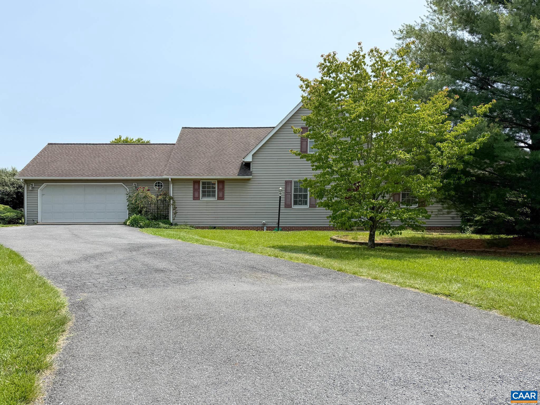 One level living in a well desired area with close proximality to the hospital, shopping, schools and interstate in this beautiful 1/2 acer lot with lovely mountain views, open floor plan and gorgeous sun room with skylight. Hardwood floors throughout and a Loft that acts as a 4th bedroom. Private and spacious backyard with recently built back deck for entertaining. Downstairs you will find a finished basement space with full bathroom and access to the outside yard. The home features a spacious living room with vaulted ceilings and exposed beams-adding charm and character throughout. A 2-car attached garage provides plenty of space for vehicles, tools, or hobbies.