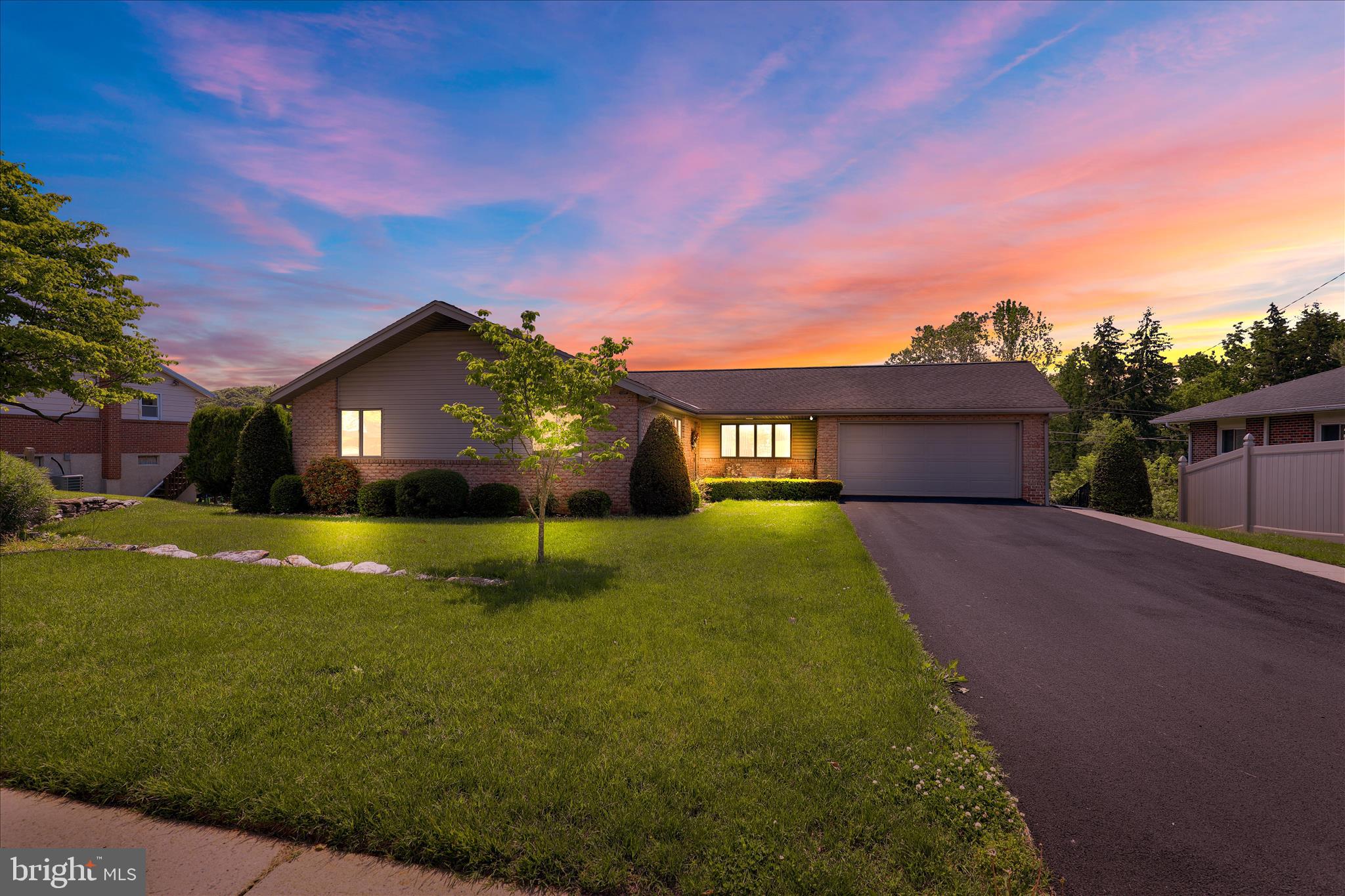 Nestled in a warm and friendly community, this exquisite ranch-style residence offers a harmonious blend of comfort and sophistication. The inviting interior features a spacious layout with three well-appointed bedrooms and two and a half bathrooms, including a primary suite where a pocket door in the bathroom separates the vanity and the stall shower. The heart of the home is the 27 pull wood cabinet, eat-in kitchen with granite countertops and tiled backsplash. There are modern appliances, including a 5 burner gas range and dishwasher, perfect for culinary enthusiasts. The combination dining and living area, enhanced by an elegant gas fireplace, creates a warm ambiance for gatherings. Step outside to discover a deck with benches around the edges, a concrete patio below and a nicely landscaped, fenced lot that is .22 acre. The exterior boasts durable brick and vinyl siding, and the convenience of an attached oversized garage with additional storage, along with ample driveway space for guests. There is a fully finished basement featuring a walkout rear patio door and daylight windows offering two areas for entertaining and relaxing, A conversation ares with a gas fireplace in a stepped-down level  and a bar and open area for possible gaming tables and a sliding patio door to the exterior. There is another room that was used as a beauty shop  that has it's own entrance and a powder room. Located in a serene suburban setting, this home offers easy access to local amenities while providing a peaceful retreat.  Experience the exclusive lifestyle that this remarkable home has to offer, where every detail has been thoughtfully curated for your comfort and enjoyment.