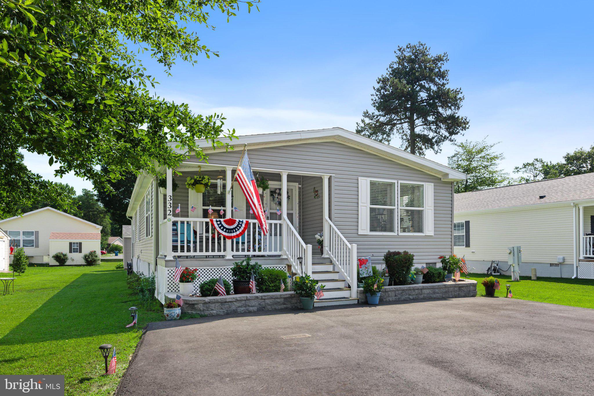 Welcome to 332 Graham Branch Rd in the Village of Cool Branch, a 2022-built home offering nearly new living at a value below current new construction in the community.

Compared to new construction currently offered in the neighborhood at higher price points, this home delivers modern finishes and condition without the new-build premium. Inside, the layout is open and efficient, with the living, dining, and kitchen areas flowing together. The kitchen is the centerpiece of the home, featuring a large island with seating, stainless steel appliances, a farmhouse sink, and an exceptional amount of cabinetry for storage.

All three bedrooms are located toward the back of the home, creating a quieter, more private sleeping area. The primary suite includes a spacious en suite bath with a beautifully tiled walk-in shower. Two additional bedrooms and a full hall bathroom provide flexibility for guests, office space, or hobbies. A dedicated laundry and mudroom with exterior access adds everyday convenience. Outside, the home sits on a well-maintained lot with a large backyard and attractive landscaping. There are even gutter guards to help limit yearly maintenance. 

Village of Cool Branch is a gated community with key-code access and amenities including a swimming pool (at no additional fee!), playground and fishing pond. The monthly land lease is $607 and includes water, sewer, and trash service.
Conveniently located approximately 10 minutes from shopping, dining, medical services, and daily needs, this home offers a well-kept community setting with both privacy and accessibility.