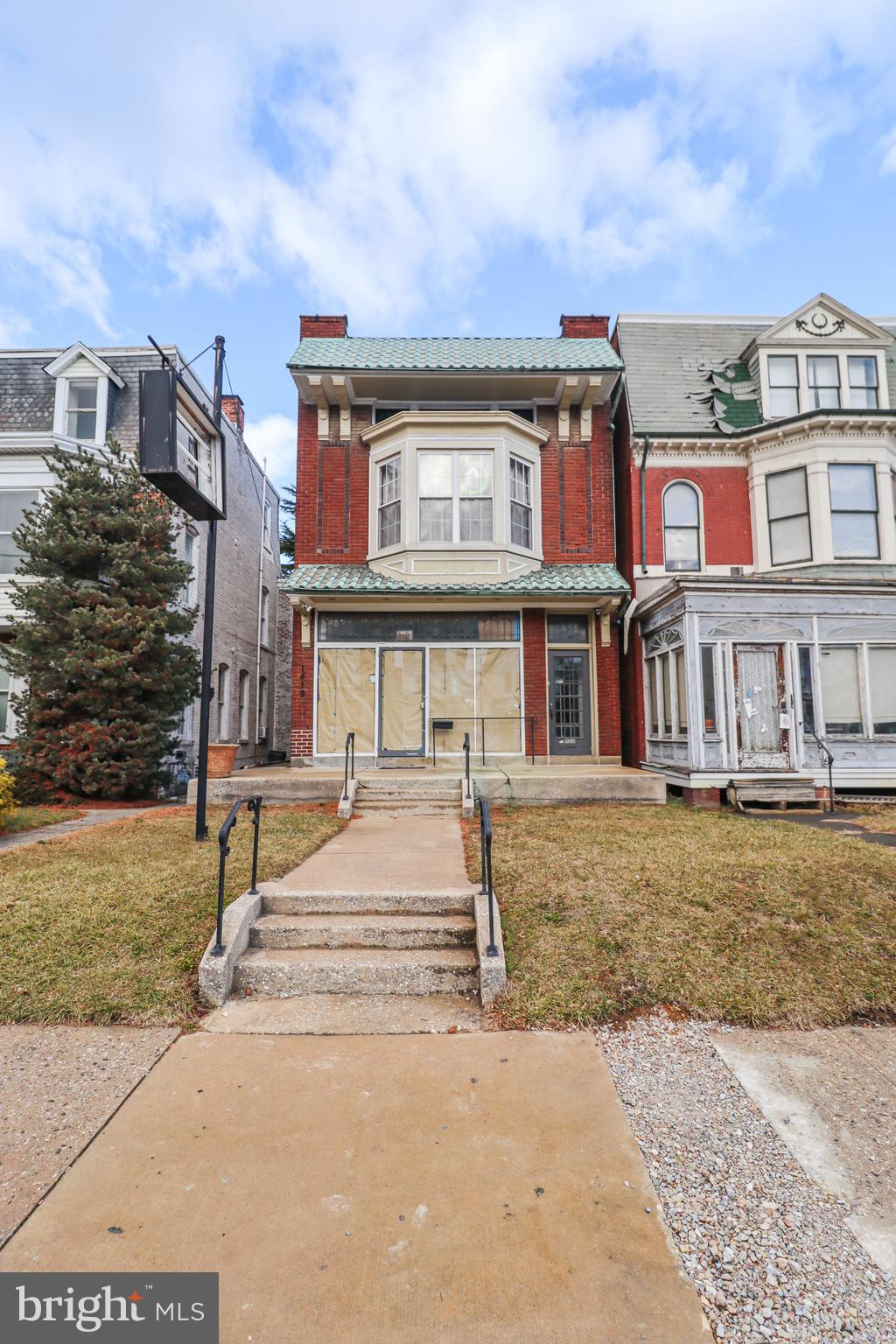 This commercial property located in West York features a second-floor 2-bedroom apartment, offering a spacious and modern living environment that is currently rented. The first floor comprises a mixed-use commercial space that is vacant.  Additionally, the property includes a 3-car garage, enhancing accessibility for tenants and customers. Situated in a vibrant area with good foot traffic, this location presents an excellent opportunity for entrepreneurs to bring their business ideas to life, whether it's a retail shop, office space, or service-based venture. This property not only serves as a residential investment but also capitalizes on the growing demand for commercial services in the community.