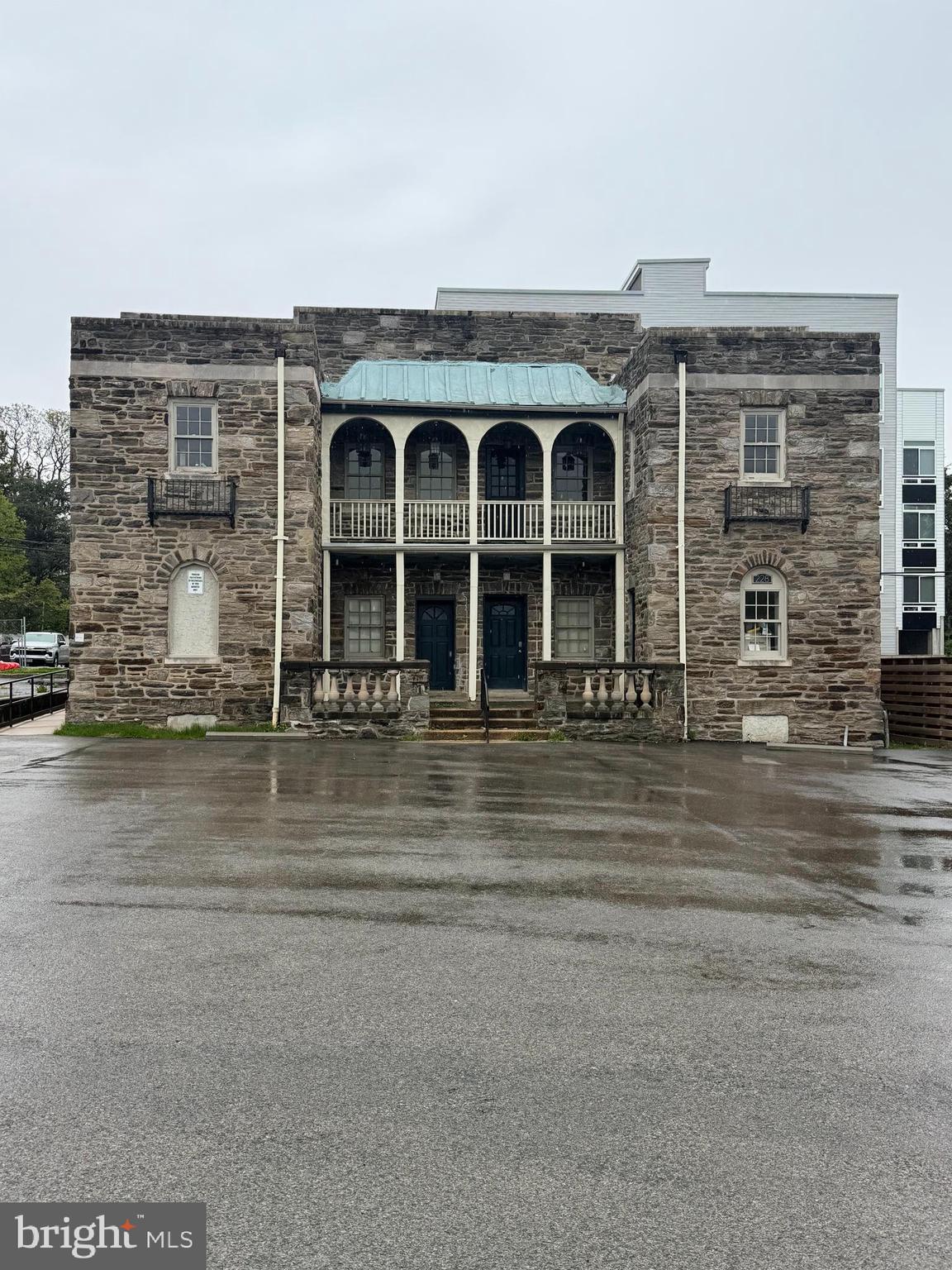 Positioned along the bustling Chelten Avenue corridor in the heart of Germantown, this property offers an exceptional blend of immediate income potential and transformational development potential. The 60' of frontage along Chelten Avenue offers outstanding street-level exposure for retail, office, medical, or service-oriented businesses. The large parking lot (30+ cars) provides ample off-street parking for clientele. An existing 6,000 sq ft commercial building (built circa 1910) sits at the back of the lot and is currently configured into five separate office spaces - four occupied on month-to-month Leases and 1 vacant space.