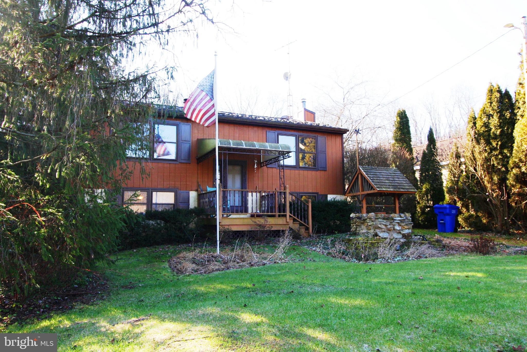 Offer DEADLINE is Monday January 8th at 5 PM!  4 Bedroom 2 Full Bathroom Custom Split Foyer with vaulted wood ceilings, skylights and exposed beams.  Home needs TLC.  Sold "As-Is".  Estate Sale.  This property features a deep backyard, shed w/ electric and a large deck off of the Sun Room.  Nice Living Room and eat in Kitchen.  The Sun Room has parquet wood flooring and a trap door to the lower level for egress.  The Primary Bedroom opens to the Full Bathroom with a skylight.  Another nice sized Bedroom on the main level.  The lower level has a very large Family Room with wood walls and a stone wood burning fireplace.  Two more Bedrooms, Full Bathroom and Laundry Room round out this level.  This home needs some work, but is in good condition.  Please make an appointment with a Realtor before coming on the property, it is currently occupied.