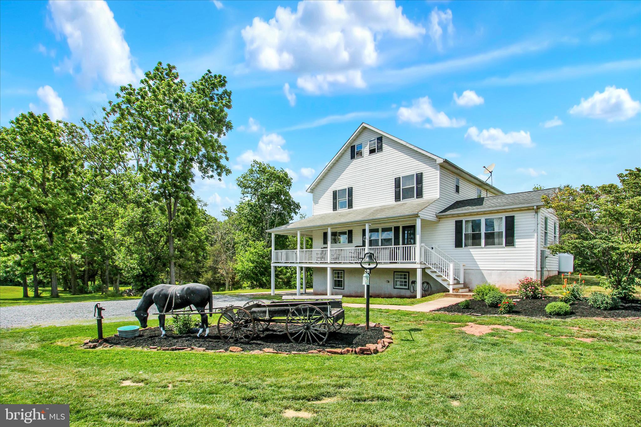 Welcome to your private country retreat, perfectly suited for horse enthusiasts, hobby farmers, homesteaders, and those seeking space to live, grow, and entertain. Situated on 22.39 acres with Clean and Green agricultural zoning, this beautifully updated property offers endless opportunities for horses, livestock, chickens, ducks, gardening, and sustainable living with multiple greenhouses, stalls, and open land ready for your vision.

The home features over 4,000 sq. ft. of living space with 6 bedrooms and 3.5 bathrooms, including a remodeled lower-level in-law suite with its own separate walk-out entrance. Extensive landscaping improvements and numerous updates have been completed since 2022, creating a property that is both functional and beautifully maintained. Additional highlights include a wrap-around porch, walk-up attic, geothermal-ready plumbing, propane furnace, and a 1,000-gallon underground propane tank used to heat the greenhouses. All appliances convey with the sale.

Whether you're dreaming of homesteading, creating your own farmette, expanding an equestrian setup, or simply enjoying peaceful country living with modern conveniences, this exceptional property offers the perfect balance of comfort, acreage, and versatility.