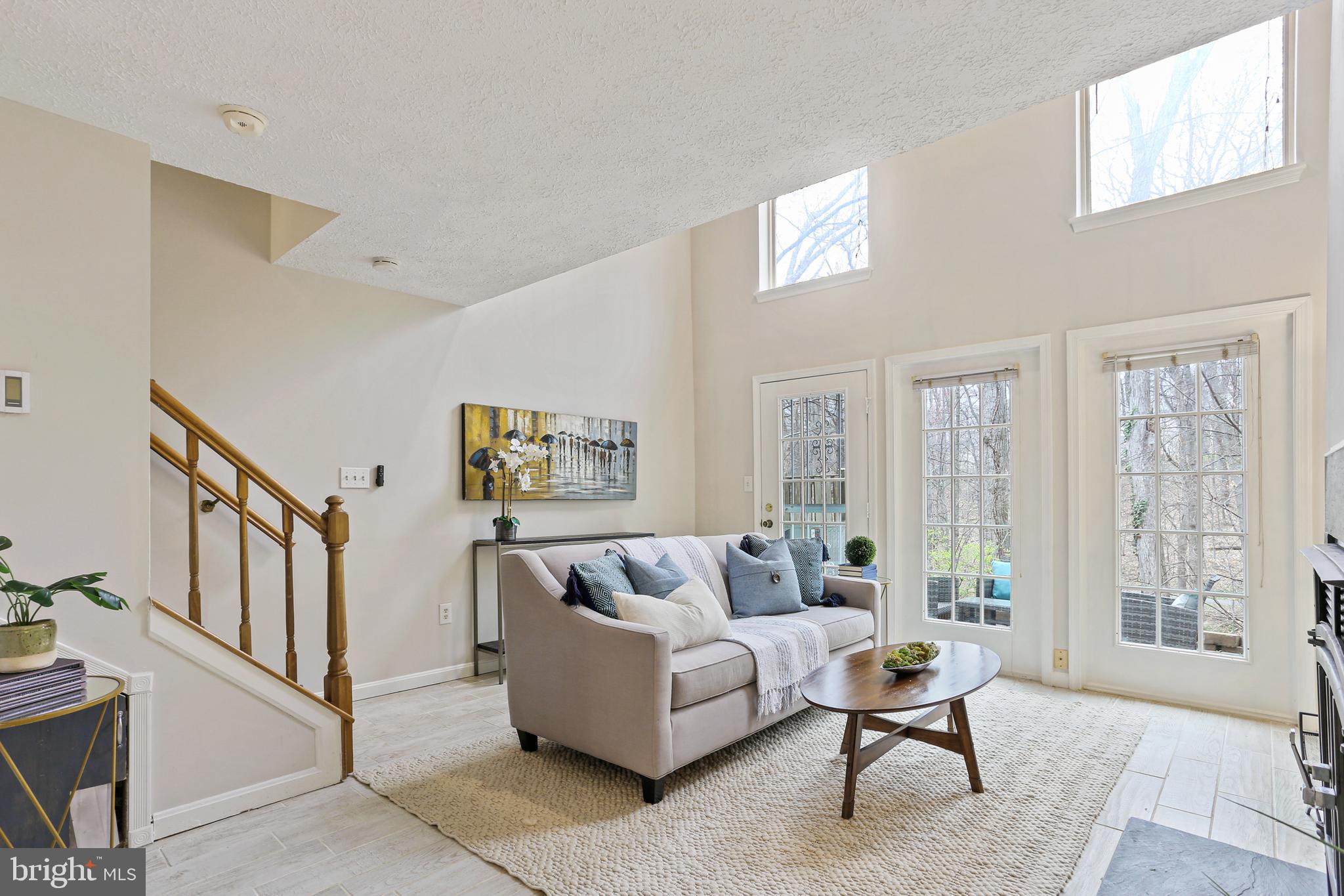 Don’t miss the opportunity to own this nature lover’s dream home with stunning lake views nestled in the highly sought-after Landing Glen community. This charming, four-level, three-bedroom, three-full-bath/one-half-bath townhome is filled with natural light and seamlessly blends space, character, and functionality.

As you enter, you'll be greeted by a welcoming foyer with updated flooring, a convenient powder room, and a hallway that leads into a cozy living room. Vaulted ceilings and oversized windows offer stunning views of lush privacy and surrounding trees, creating an airy, light-filled atmosphere. The main level features a kitchen with updated waterproof luxury vinyl plank flooring and a spacious eat-in area—perfect for enjoying meals with family and friends. 

The upper level includes a magnificent Master Bedroom-Suite which is a true retreat featuring a private bath with dual-sink vanity, impressive 20+ foot cathedral ceilings, two skylights with decorative-custom indoor shutters, two large closets for optimal storage, and a bonus, full-sized-staircase-accessible loft area. This versatile loft space can be used as an office, gym, or additional living area—an exceptional feature unique amongst this community. Additionally, the upper level includes a generously sized second bedroom connected to its own full, private bathroom. This bedroom is flooded with natural light from three large windows and offers a spacious closet.

The lower level features a spacious living area with a cozy wood-burning fireplace, perfect for winter nights, and is further enhanced by a heated-tile floor for added comfort. A versatile flex room, ideal as a guest suite, in-law suite, or office, is complemented by an additional full bathroom, setting this property apart from others. An updated, full-sized washer and dryer complete the lower level.

Step outside your sliding glass door to be amazed by the stunning  lake view from your back patio, a perfect space for grilling and entertaining.  The rear entrance provides immediate access to ten-miles of Montgomery County Recreation Trails and Black Hills State Park. Carry your kayak one-minute down the trail from your backdoor to launch into one of Montgomery County’s most popular freshwater recreation sites, Little Seneca Lake-Reservoir. Enjoy the year-round privacy and beauty of the forest and lake backing your property.

This home has been well maintained and includes recent updates such as brand-new-carpet throughout as well as floor to ceiling paint for the new owner(s) to move right in comfortably. The community offers fantastic amenities, including a pool, tennis courts, tot lots, and landscaping maintenance. Never worry about cutting grass again. Waters Landing Park, just a short distance away, also features basketball courts, picnic shelters, playgrounds, soccer fields, and tennis courts.

Conveniently located with easy access to the MARC train, bus lines, plenty of restaurants and major shopping centers including large box retailers such as Wegmans, Target, Home Depot, Walmart, and Giant. This home is also just minutes from I-270, making commuting a breeze. With all of these incredible features, this is truly the definition of "location, location, location!"