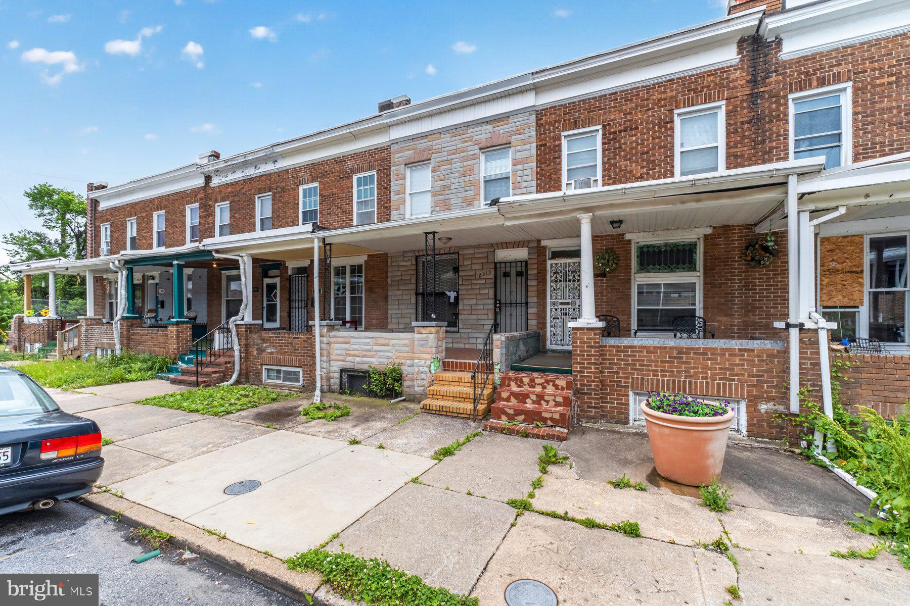 A cute 3BR/2BA Townhome located on a quiet street is waiting for a new homeowner to give it a facelift.  Walk up to the covered front porch and open the door into an open concept main floor plan featuring high ceilings and abundant natural light.  The main floor features a full bath with a walk-in shower, a large living room/dining room, and an eat-in kitchen. The second floor contains two sizable secondary bedrooms, a larger primary bedroom, and a full bathroom with a walk-in shower.  The lower level offers additional living space featuring a finished recreation room with unfinished space for laundry and utilities, and provides access to the yard.  From the kitchen step outside to a covered deck that leads to a fenced yard full of possibilities.  This home is ideal for the DIY homeowner or investor and is located close to shopping, restaurants, and commuter routes.