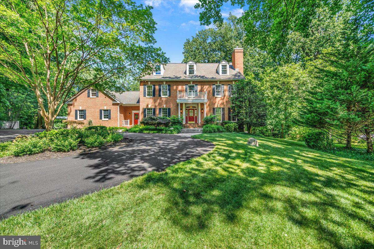Welcome to this exceptional, custom-built estate nestled on a quiet cul-de-sac across 6.5+ private acres! A newly paved, asphalt circular drive provides a grand arrival to this 3-finished-level masterpiece, blending extensive trim work, crown molding, and stunning Brazilian cherry flooring throughout. Experience unparalleled luxury with 5 fireplaces, including a cozy wood-stove insert in the great room and 4 gas/propane fireplaces warming the formal spaces, recreation room, and primary suite. The gourmet kitchen is a chef’s dream, equipped with premium GE Monogram appliances, a large center island, and a bright breakfast room with custom built-ins. The main level rounds out with a dedicated and expansive wet bar station just off the great room, French doors leading to the formal dining room, and double glass doors opening into your private office with sleek glass shelving.Upstairs, the spectacular primary suite features walk-in closets and a spa-like bath with an elevated jetted tub and an oversized steam shower. Directly off the primary bedroom, a versatile fourth bedroom with a connecting door serves as an ideal nursery, dressing room, or private lounge area. Two additional bedrooms (including an ensuite) and a full laundry room complete this level. A separate staircase leads up to an expansive, unfinished second upper level, thoughtfully designed for future expansion or massive additional storage. Returning toward the main-level mudroom, a separate private staircase ascends to yet another fully finished space—perfect as a fifth bedroom or second private office—positioned quietly above the 3+-car garage.The fully finished, walk-out lower level is the ultimate hangout, featuring a recreation room with a full bar (and, yes, the pool table conveys!), a workout room, and a full bath. Outside, your private oasis awaits with a sprawling paver patio, hot tub, arbored flagstone terrace, and a professional putting green with 5 sand traps—complete with pin flags. A large permanent shed easily accommodates all your lawn tools, garden supplies, and recreational gear. A rare, turnkey estate that truly has it all!