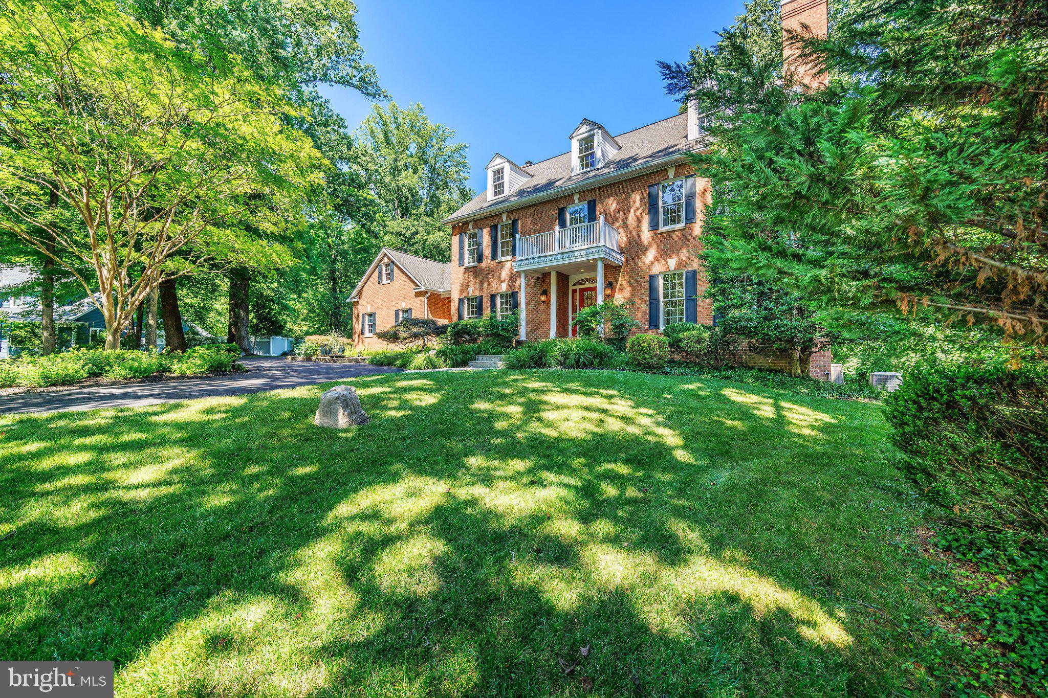 Welcome to this exceptional, custom-built estate nestled on a quiet cul-de-sac across 6.5+ private acres! A newly paved, asphalt circular drive provides a grand arrival to this 3-finished-level masterpiece, blending extensive trim work, crown molding, and stunning Brazilian cherry flooring throughout. Experience unparalleled luxury with 5 fireplaces, including a cozy wood-stove insert in the great room and 4 gas/propane fireplaces warming the formal spaces, recreation room, and primary suite. The gourmet kitchen is a chef’s dream, equipped with premium GE Monogram appliances, a large center island, and a bright breakfast room with custom built-ins. The main level rounds out with a dedicated and expansive wet bar station just off the great room, French doors leading to the formal dining room, and double glass doors opening into your private office with sleek glass shelving.Upstairs, the spectacular primary suite features walk-in closets and a spa-like bath with an elevated jetted tub and an oversized steam shower. Directly off the primary bedroom, a versatile fourth bedroom with a connecting door serves as an ideal nursery, dressing room, or private lounge area. Two additional bedrooms (including an ensuite) and a full laundry room complete this level. A separate staircase leads up to an expansive, unfinished second upper level, thoughtfully designed for future expansion or massive additional storage. Returning toward the main-level mudroom, a separate private staircase ascends to yet another fully finished space—perfect as a fifth bedroom or second private office—positioned quietly above the 3+-car garage.The fully finished, walk-out lower level is the ultimate hangout, featuring a recreation room with a full bar (and, yes, the pool table conveys!), a workout room, and a full bath. Outside, your private oasis awaits with a sprawling paver patio, hot tub, arbored flagstone terrace, and a professional putting green with 5 sand traps—complete with pin flags. A large permanent shed easily accommodates all your lawn tools, garden supplies, and recreational gear. A rare, turnkey estate that truly has it all!