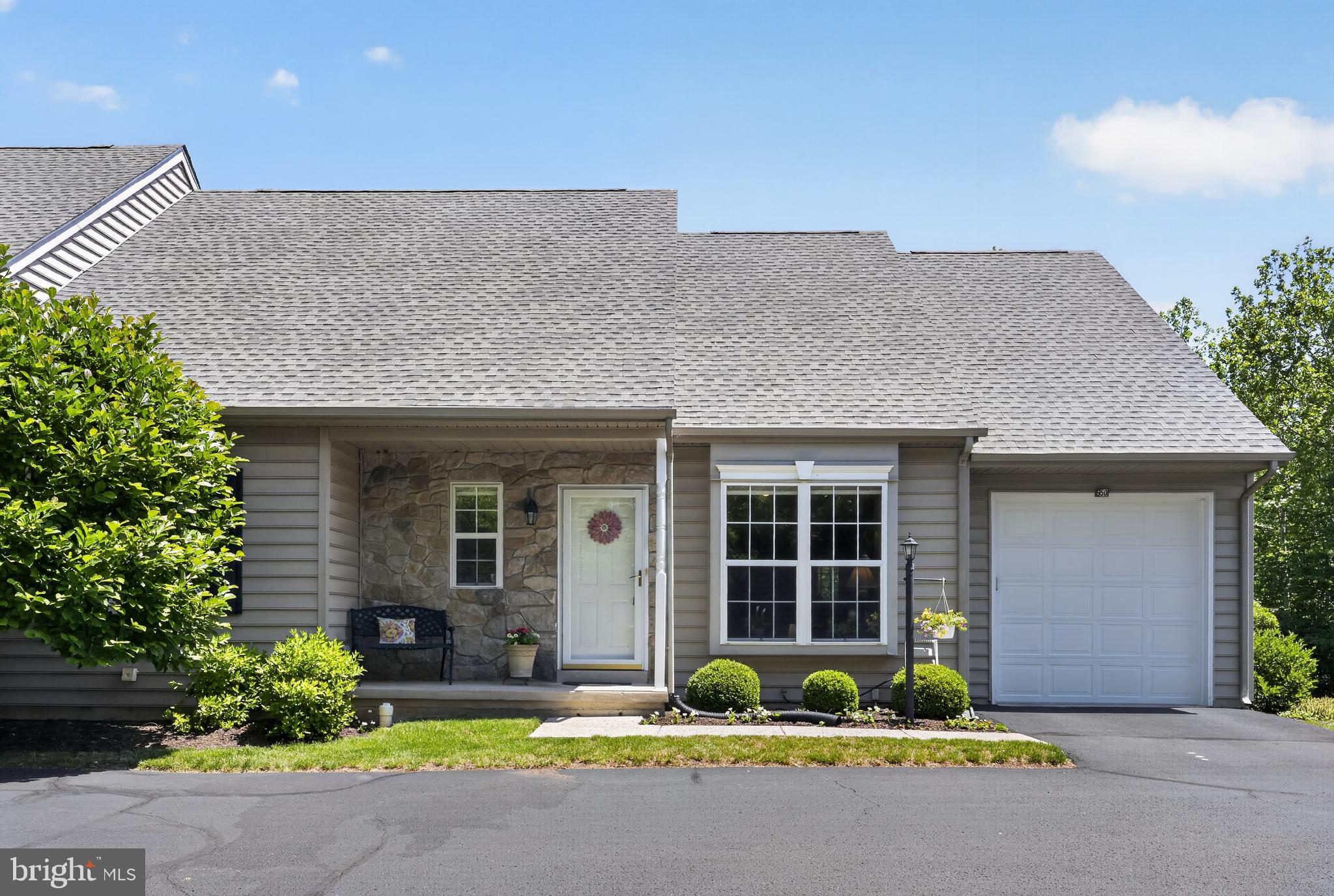 Welcome to Gwynedd Commons, a sought-after 55+ community in Lansdale. This well-maintained home offers comfortable one-floor living with the added flexibility of a spacious second-floor loft featuring brand new carpet and a ceiling fan with light. The inviting living room showcases luxury vinyl plank flooring, crown molding, a box window, and 9-foot ceilings that continue throughout the main level. Entertain with ease in the dining room highlighted by crown molding, chair rail, recessed lighting, and a programmable thermostat. The kitchen is thoughtfully designed with granite countertops, a deep stainless-steel sink, subway tile backsplash, soft-close cabinets and drawers, pull-out shelves, pot drawers, a built-in microwave, self-cleaning oven, refrigerator with ice maker, recessed lighting, and a ceiling fan with light. The adjacent family room features a gas fireplace with marble surround and Mt. Vernon mantel, double window, included window treatments, and a door leading to the oversized 17' x 12' deck overlooking open space and accented by a retractable awning. The main-level primary suite offers a walk-in closet and private bath with stall shower, while a second bedroom with double closet is conveniently located near the full hall bath, providing comfortable accommodations for guests. A main-floor laundry area with storage cabinets adds everyday convenience. Additional highlights include hardwood stair treads to the loft, a security system, newer HVAC system, and a new roof installed in 2025. The one-car garage features an automatic opener and exterior keypad access. Expanding the home's living space is a large full finished walk-out basement with carpeting, a double window, and French door that brings in abundant natural light, offering endless possibilities for recreation, hobbies, entertaining, or storage. Conveniently located near the Pennsylvania Turnpike, major roadways, shopping, dining, and everyday services, this 2-bedroom plus loft, 2-bath home offers the space, flexibility, and lifestyle today's buyers are seeking.