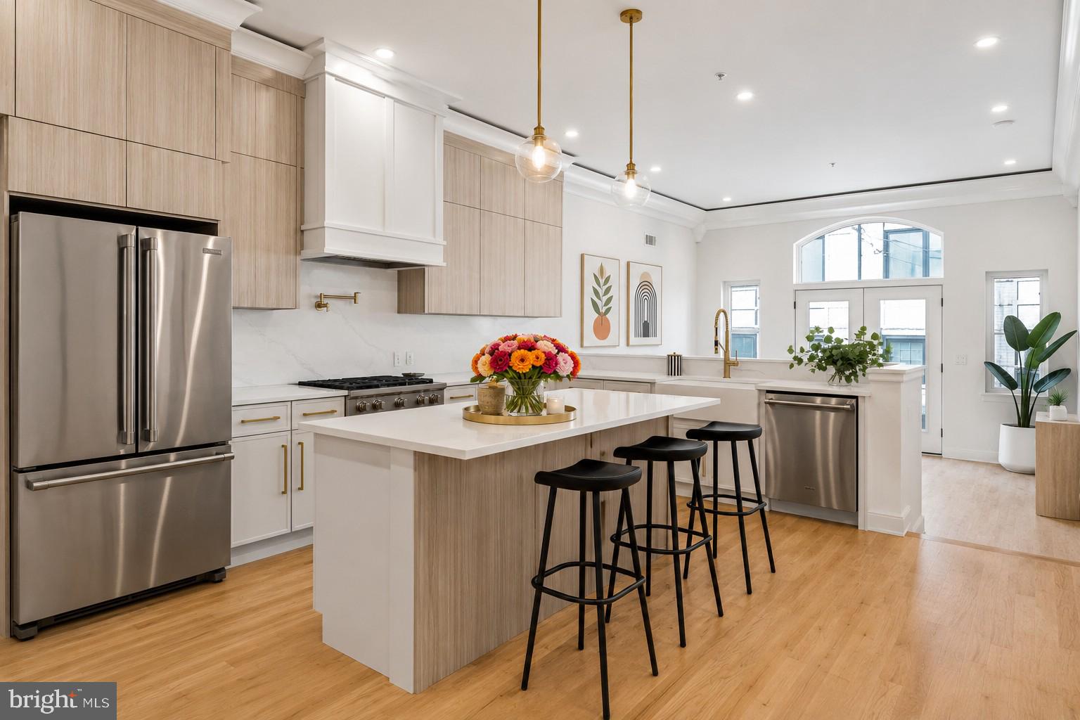Experience modern luxury in the heart of Northern Liberties with this stunning new construction home offering 3,400 square feet of thoughtfully designed living space. Featuring 4 spacious bedrooms, 4 full baths, 2 half baths, ELEVATOR, and rare 2-car rear parking, this home is loaded with upscale finishes, soaring ceilings, and an abundance of natural light pouring through oversized windows on every level. The open-concept main living area is ideal for both everyday living and entertaining, centered around a gorgeous designer kitchen complete with sleek custom cabinetry, high-end appliances, a large waterfall island providing additional seating, and ample storage and prep space. Retreat to the luxurious primary suite featuring a spa-inspired bathroom designed for relaxation, complete with a soaking tub, oversized glass-enclosed shower, double vanity, and elegant modern finishes. The expansive roof deck serves as the ultimate urban oasis, offering breathtaking panoramic city views and the perfect setting for entertaining or unwinding after a long day. A private 5-stop elevator provides seamless access throughout the home, while the finished basement offers flexible bonus space perfect for a media room, home gym, playroom, and/or guest suite. Ideally situated just steps from the vibrant shops, restaurants, and nightlife along 2nd Street and moments from Fishtown, this exceptional home places you in the center of one of Philadelphia’s most exciting neighborhoods. Taxes and square footage are the responsibility of the buyer to verify independently. *Tax abatement pending.*