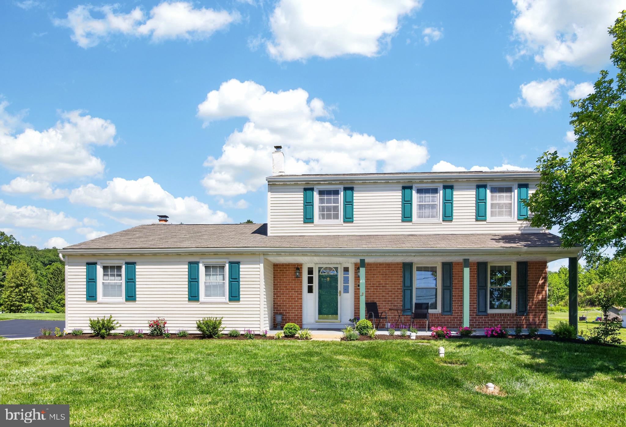 Welcome to 2 Revere Lane situated in the quaint area of Glenmoore! In the Award winning Downingtown East schools and STEM Academy!! This 4BR/2.1BA Colonial home is ready to move in.  You are welcomed by a large front porch that you can sit and admire the view. Your entry is  highlighted by gleaming hard wood floors and a coat closet.  Adjacent is a Large Living Room w/ hardwood floors and a double door entry into the Dining area of the kitchen. Totally redone in 2002 you will find a very workable kitchen w/ Maple cabinets, Island w/ 4 people overlooking the Family room, Double porcelain sink, tile back splash, Kitchen Aid D/W (12/2023), SS 5 burner Fridgidaire stove, Microwave and a Door leading to a patio.  The Family Room off the Kitchen has New carpet, Brick Wood Fireplace w/ Brick hearth and mantel. The Sunroom w/ a Cathedral Ceiling adds a high level of enjoying your nights to cook out and using as a place to read a book or enjoy a cocktail.  There are 2 convenient Outside entrances,  Luxury Vinyl Plank floor, recessed lights and a Ceiling fan.  As you ascend to the second floor it boasts A Master Bedroom w/ Master Bath that has 12x12 tile, Stall shower and vanity.  There are 3 Addt'l Br's (2 are Very large), Remodeled Hall bath, Linen closet and Newer (2017) windows on the second floor.  The 3rd level of living is the Full finished basement.  It has a TV room, Game Room, Cedar closet, Laundry Hot Water heater (2016) and a Utility room.  There has been a French Drain installed (2012), The well has a neutralizer (12/2023) and Close to $15,000 for a new system.  Other property highlights are: New roof (2016), Invisible Fence w/ Collars, 2 car garage w/ Openers and NEW Pull down stairs to floored attic, Newer Driveway (2023) was excavated out, repaired and seal coated, Chimney (9/2025) had flue cleaned, redone and re-stuccoed approx ($15,000). The Owners have been very detailed to maintain this home for the last 24 years!!  Show and Sell!