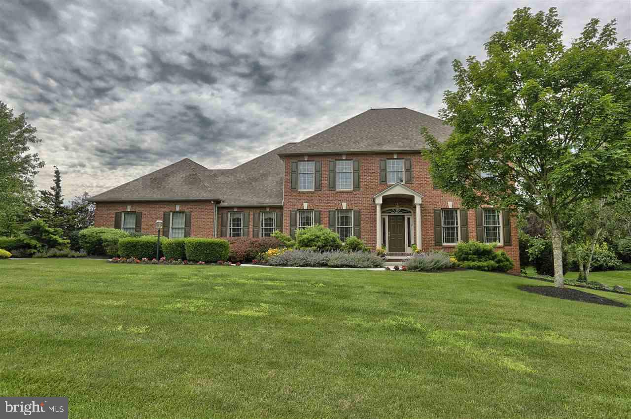 Mumper built classic! Lovingly cared for custom home. Terrific floor plan for entertaining. Fantastic finished walk-out lower level leads to 3000 sq. ft. of hardscape. A 20x40 heated Crystal pool, pool house, professionally created pond w/waterfall, underground sprinklers in landscape beds in very private lot. 14.6x40 maintenance free deck off breakfast area overlooks this beautiful setting.
