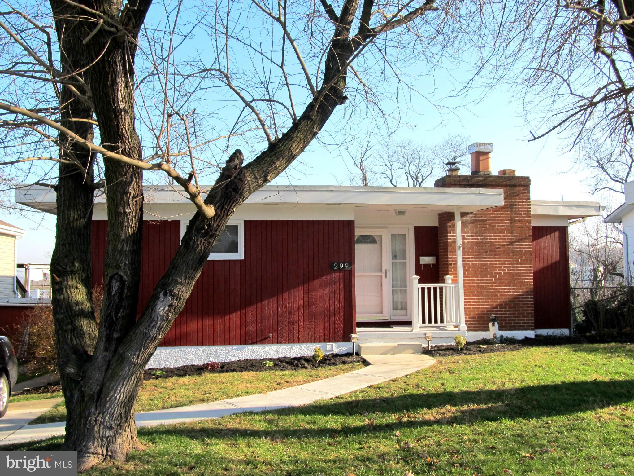 Pack your bags!  This 3 bedroom, 2 bath rancher is move in ready!  Freshly painted, beautifully restored hardwood floors, brand new tile floor in remodeled kitchen, brand new 2nd full bath, brand new electrical box!   Cozy up around the wood burning fireplace in winter and spend time on the deck overlooking nice rear yard in the summer!  Own your own home for the price of renting!  Come see!!
