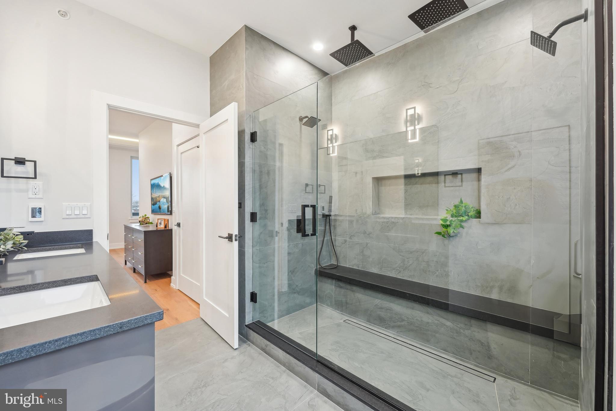 Discover the best of contemporary city living at Elkhart Residences, a brand-new townhome community nestled in the heart of one of Philly’s fastest-growing neighborhoods. These thoughtfully designed homes offer approximately 1,800–2,000 square feet of living space across three levels—plus a private parking space for added convenience (yes, you get a parking spot in the city!).

Each unit boasts sleek hardwood flooring throughout, ambient tray ceiling lighting, and an airy layout designed for modern lifestyles. The living room features expansive glass partitions that allow natural light to pour in, making the space feel even more open and inviting.

All bathrooms come with heated floors, including the spa-like master suite with an elegant glass-enclosed shower and the second-floor bath featuring an oversized soaking tub. And just when you thought it couldn’t get better—every home comes with a glass partition accent for that extra wow-factor.

Want more space? The homes also include an unfinished basement with 600+ square feet of potential—ideal for a future home gym, playroom, movie den, or bonus living area. (Some units may even come with a finished basement already done for you!)

Step outside to your spacious third-floor balcony—perfect for sipping coffee, catching sunsets, or entertaining guests on warm summer nights.

All appliances are included in the sale, making your move-in seamless. Plus, you're just minutes from local schools, a newly renovated neighborhood park, and all the charm Port Richmond has to offer.

Pre-construction pricing ranges from $550,000 to $575,000—an incredible value for a home that truly checks all the boxes.

Elkhart Residences: where smart design, everyday luxury, and community vibes come together. Secure your space today before they’re gone!