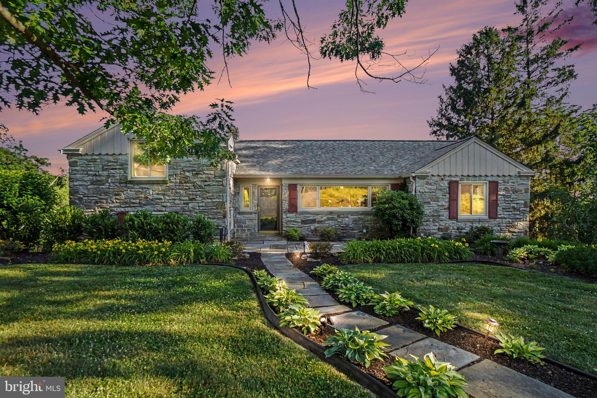 Tucked away in Manheim Township's sought-after Blossom Hill neighborhood, this distinctive fieldstone and stucco home offers a rare combination of architectural character, modern updates, and exceptional living space.

Designed with a unique multi-level layout, the home features four bedrooms, two full baths, and a variety of inviting spaces that provide both flexibility and function. A sun-filled living room with fireplace, spacious family room, and bright sunroom create comfortable gathering areas throughout the home, while the beautifully updated kitchen flows seamlessly into the dining area, ideal for everyday living and entertaining alike.

The upper levels offer four generously sized bedrooms and two full baths, providing privacy and separation from the main living areas. Thoughtful updates throughout enhance the home's comfort and efficiency while preserving its timeless appeal and distinctive character.

Step outside and discover your own private retreat. A covered patio, expansive composite deck, and mature landscaping create inviting outdoor spaces for relaxing, entertaining, or simply enjoying the peaceful setting.

Extensive improvements over the years, including the kitchen, baths, windows, roof, solar system, electrical service, driveway, and more—allow the next owner to enjoy the home with confidence.

Offering character, space, and a highly desirable location, this is a truly special opportunity in one of Lancaster's most established neighborhoods.