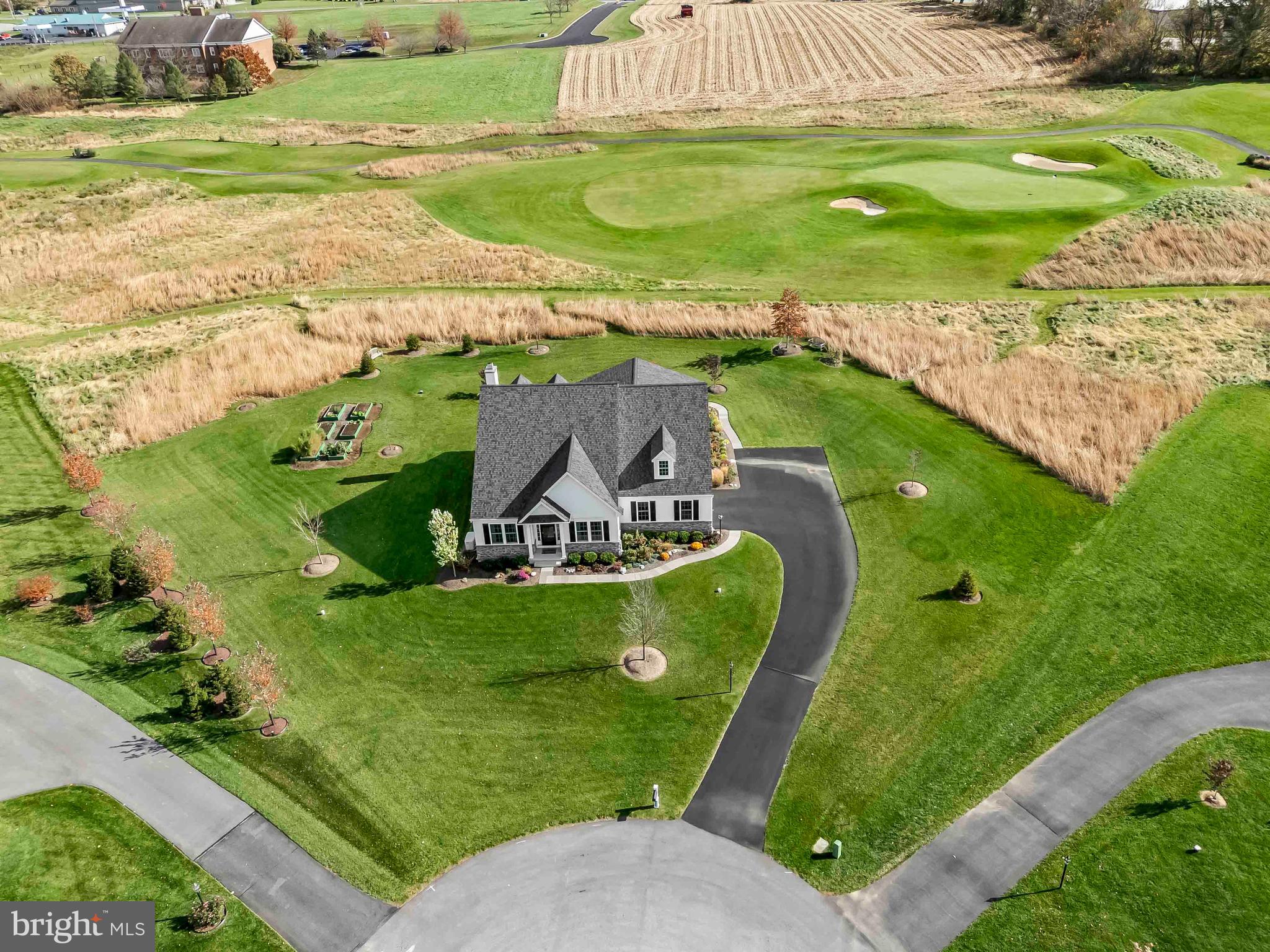 Welcome to 275 Bentley Dr — a rare opportunity to enjoy upscale, newer one-floor living in a peaceful golf course setting. Built in 2023 by Cedar Knoll Builders, this beautifully designed custom home is tucked away on a quiet cul-de-sac street of just 11 homes, surrounded by the scenic fairways and rolling countryside of Wyncote Golf Club. Offering the perfect blend of luxury, comfort, and long-term value, this home is ideal for buyers seeking an easier lifestyle without sacrificing space or quality.

Perfectly positioned on a desirable 1.1 acre lot, the Amelia model offers timeless curb appeal with extensive landscaping, HardiePlank siding, stone accents, a 40-year roof, double-hung tilt & pull-out windows, and an oversized insulated garage. Outdoor living is just as impressive with a private screened porch and adjoining paver patio—perfect for relaxing evenings, entertaining guests, or simply enjoying the peaceful views.

Inside, the open-concept layout was thoughtfully designed for everyday functionality and effortless entertaining. Luxury vinyl plank flooring flows throughout the home, while oversized windows fill the space with natural light and showcase the surrounding countryside. The gourmet kitchen serves as the heart of the home and features abundant cabinetry, stainless GE appliances with gas cooking, quartz and granite countertops, tile backsplash, a walk-in pantry, and an oversized island with seating—ideal for gatherings both large and small.

The adjoining family room offers a warm and inviting atmosphere with a wood-burning fireplace and beautiful rear views. Privately tucked away at the back of the home, the spacious primary suite creates a peaceful retreat featuring tranquil views and a luxurious bath with a frameless glass tile shower.

Designed with flexibility in mind, the home also includes two additional bedrooms, a full hall bath, and a versatile study with custom built-in bookcases that can easily function as a home office, library, den, or formal dining room depending on your lifestyle needs. A convenient main-floor laundry room with utility sink adds to the ease of one-floor living.

The partially finished basement expands the possibilities even further with a guest powder room, a large unfinished storage area, and excellent potential for future finishing—whether you envision a home gym, media room, workshop, guest suite, or additional living space down the road. Major systems include a high-efficiency Carrier natural gas HVAC system, adding long-term efficiency and peace of mind.

Upscale, newer one-story homes on beautiful one-acre lots are incredibly difficult to find—especially in a setting this private and picturesque. 275 Bentley Dr offers the rare combination of luxury, flexibility, low-maintenance living, and long-term value that today’s buyers are searching for. Don’t miss this opportunity to enjoy the lifestyle you’ve been waiting for.