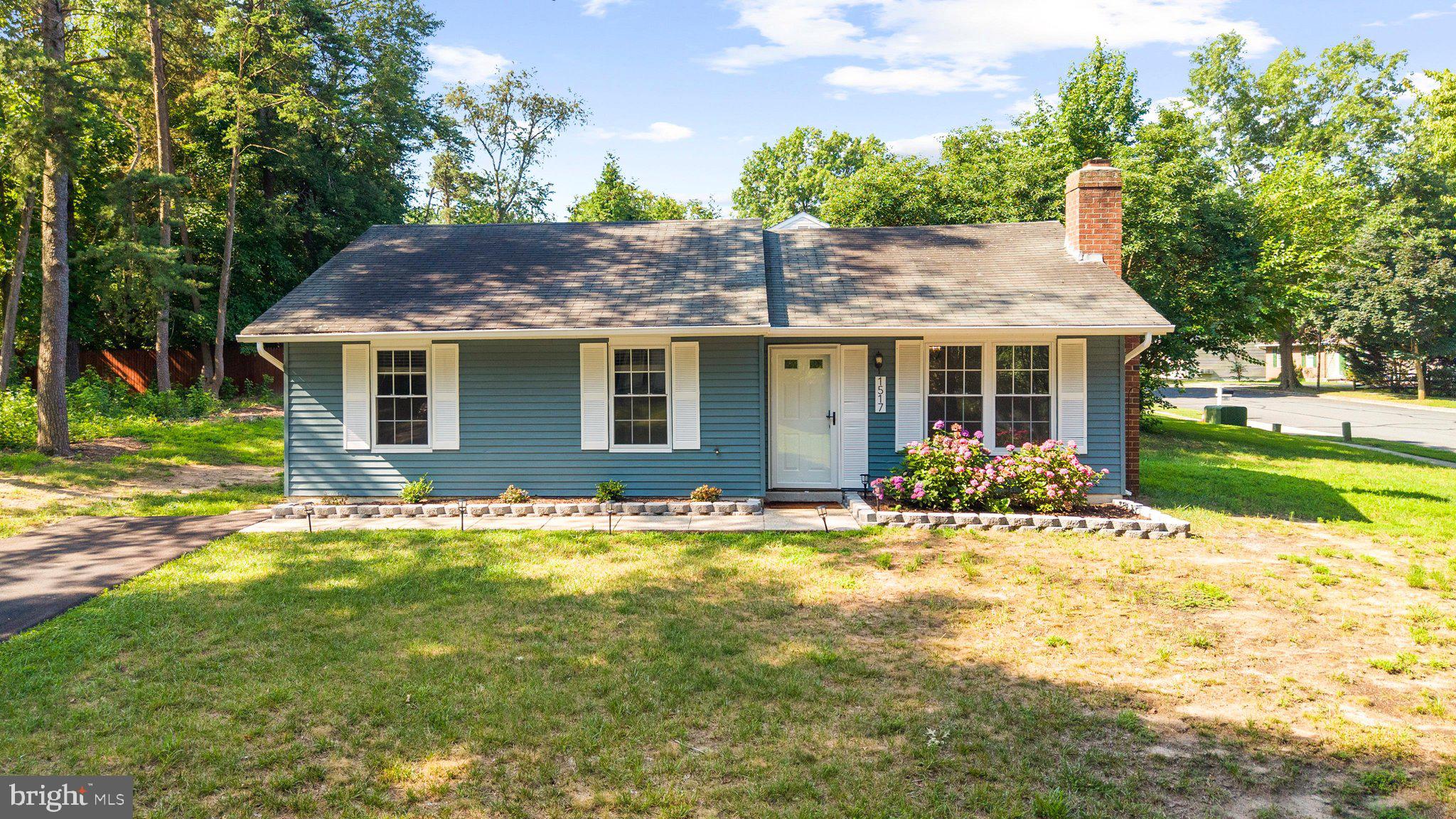 Imagine pulling into your long private driveway after a busy day, where there's room for multiple vehicles today—and the opportunity to add a detached garage or carport tomorrow. Nestled on a spacious corner lot, this charming one-level rancher welcomes you with timeless curb appeal and the promise of easy living.
Step inside and you'll immediately notice the bright, clean, modern feel. Fresh finishes and thoughtful updates create a home that's move-in ready while still offering the perfect canvas to make it uniquely yours. Sunlight pours through the newer windows, highlighting the updated kitchen with beautiful cabinetry and a fresh backsplash, while new carpeting adds warmth and comfort throughout. The renovated primary bath offers a peaceful retreat at the end of the day, and every room feels inviting, functional, and ready for its next chapter. Out back, the white wood picket fence frames a backyard that's just waiting to become the backdrop for summer cookouts, morning coffee, a game of catch, or letting pets run freely. It's the kind of outdoor space that's hard to find—private, usable, and full of possibilities. Beyond the cosmetic updates, you'll appreciate the confidence that comes with knowing the big-ticket items have already been taken care of. Plumbing, HVAC, water heater, and windows were all updated in 2020, along with new kitchen cabinetry. Additional improvements include a 2024 washer and dryer, new attic insulation with wrapped ductwork for improved efficiency, a beautifully renovated primary bathroom, new carpet, updated backsplash, and new soffits completed in 2026. Whether you're buying your first home, simplifying to one-level living, or simply searching for a home where the hard work has already been done, this is the kind of place that feels comfortable the moment you walk through the door—and one you'll be excited to call home.
