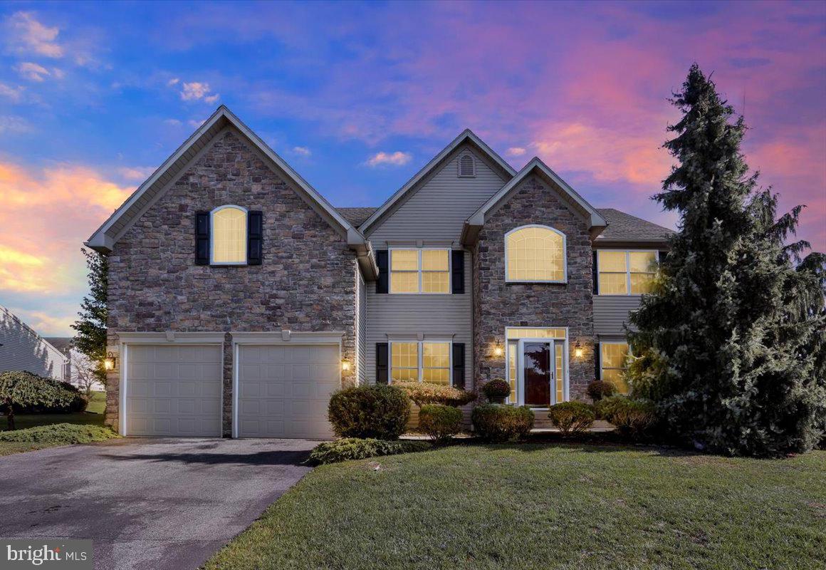 Nestled in the highly desirable Meadow Brook community within the Fleetwood School District, 173 Kensington Blvd seamlessly blends classic elegance with modern comfort. Offering 3,148 square feet of thoughtfully designed living space, with additional space in the finished basement, this beautifully maintained two-story home is move-in ready and perfectly suited for both everyday living and entertaining. A dramatic two-story foyer welcomes you inside, filled with natural light and warm, inviting finishes. Formal living and dining rooms provide the perfect setting for holiday gatherings and special occasions, while the stunning family room serves as the heart of the home with vaulted ceilings, custom coffered trim, a gas fireplace, and professionally designed window treatments. The gourmet kitchen is sure to impress, featuring stainless steel appliances, granite countertops, a pantry, breakfast area, and a built-in wine refrigerator—ideal for both casual meals and entertaining guests. A versatile bonus room on the main level provides the flexibility of an additional bedroom, private office, or guest space. Upstairs, the spacious primary suite offers a private sitting room that can easily serve as a home office or reading retreat, along with his-and-hers closets and a luxurious en-suite bath complete with a walk-in shower and whirlpool tub. Three additional generously sized bedrooms and a conveniently located second-floor laundry room complete the upper level. The finished basement adds valuable living space and endless possibilities, whether you envision a home gym, media room, or play area. Step outside to enjoy the level .36-acre lot, featuring a beautiful patio, firepit, and large storage shed—perfect for relaxing evenings, outdoor entertaining, and making lasting memories. Don't miss this exceptional opportunity to own a stunning home in one of the area's most welcoming and sought-after neighborhoods. Schedule your showing today!