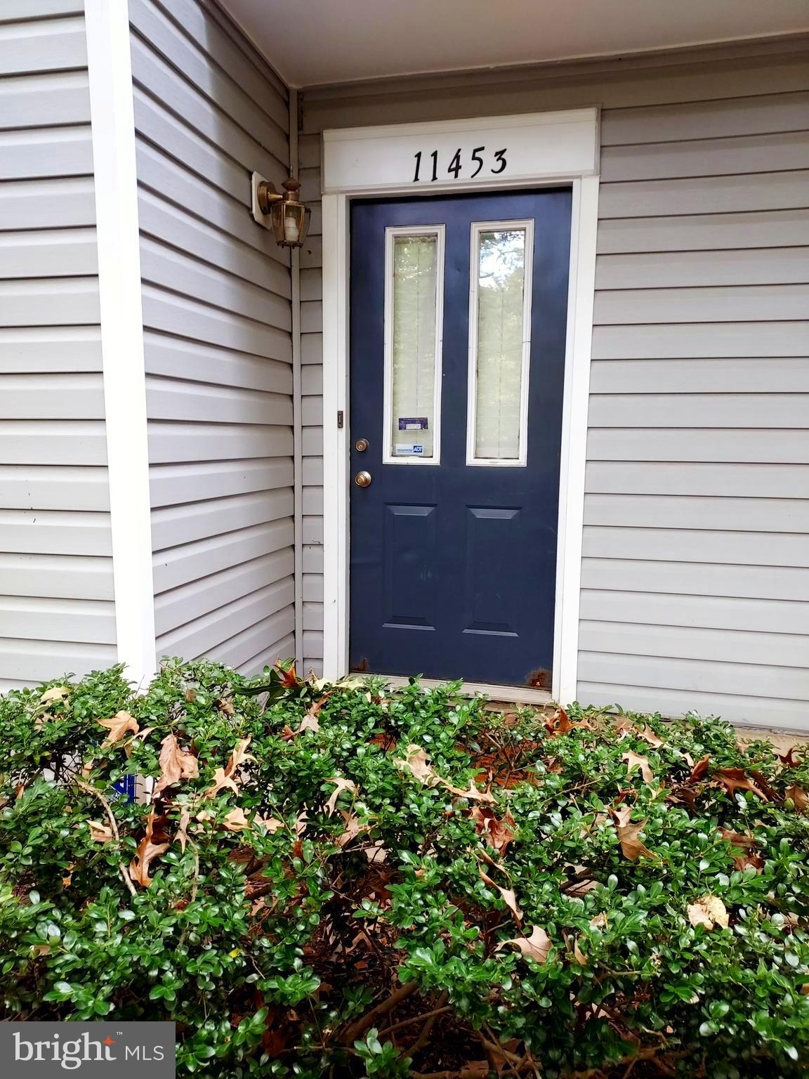 Welcome home to this beautiful end row townhouse/condo in Glensford Community.  This corner home is in a serene private setting 2 level 2 bedroom, 2 full bath condo features open space, with large living room and dining room, galley style eat-in-kitchen with patio access.  Entire 2nd level is the Owner Suite with en-suite  master bath and walk in closet.  The second bedroom  is located on the main level could also serve as a perfect set up as a guest room or office space. Main level includes its own updated full bathroom. Snuggle up in front of the cozy fireplace in the living room with access to your private patio.  Excellent location, convenient to major highways and 10 minute drive to the nearest Metro station and one exit to the new University of Maryland hospital. Major shopping with nearby Target, Safeway and Shoppers, Home Depot, Starbucks and many others, all located within 2 minutes in either direction on Annapolis Rd.