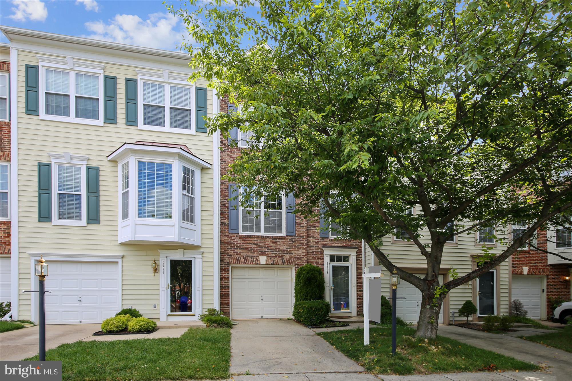 Overlook Community! This is the only row in Overlook that enjoys privacy in the front and back of home! Experience stunning nature views of parkland from the extra-large kitchen windows and back deck with stairs to go down to the patio. Gleaming hardwood flooring (which continues throughout the main level, stairs, and 3rd level). The modern eat-in kitchen with granite countertops, breakfast bar, and maple cabinets. The upper level of the home includes three bedrooms. The huge master suite features a walk-in closet with lots of shelving as well as an en-suite bathroom with large soaking tub, glass door shower, and large double vanity. The ground-level basement includes a 4th bedroom (perfect for use as an in-law suite, office, or gym!), full bathroom, and an additional living area/family room with gorgeous gas fireplace.  An oversize garage gives you extra storage opportunity. You are just steps from the neighborhood pool, tot lot, two additional playgrounds, trails, creek, tennis courts, clubhouse, and lively community events. A commuter's dream, you are located just off 495-95-395 Express Lanes inside the Beltway and 15 minutes to Pentagon/DC. You are also close to the newly refurbished Springfield Town Center and 15 minutes to Tysons, and Old Town Alexandria.