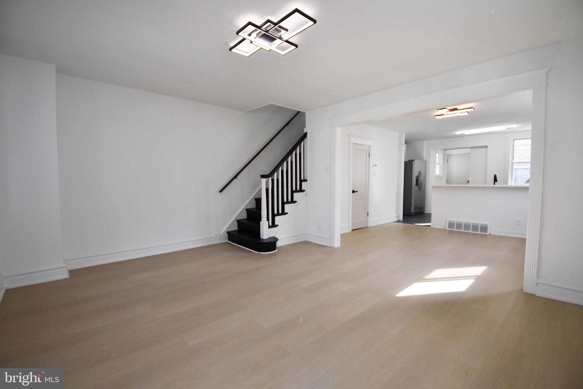 Welcome to 247 Heather Rd, a charming home that blends modern updates with comfortable, everyday living in a bright and inviting layout. Upon entry, you’re greeted by a spacious mudroom to store coats and shoes, especially during these cold and snowy winter days. Glass paneled French doors lead you to the open main level with an easy flow between the living and dining areas, creating a space that feels both welcoming and practical for daily life or casual entertaining. The fully updated kitchen features a modern two-tone cabinet design, quartz-style countertops, stainless steel appliances including a gas range, built-in microwave, dishwasher, and side-by-side refrigerator. A breakfast bar adds extra prep space and a casual spot to gather while keeping the kitchen connected to the heart of the home. Upstairs, you’ll find three sun-filled bedrooms with neutral finishes and a full bathroom with a tiled shower. The fully finished basement houses the laundry area and provides additional functional living space with comfortable ceiling height, making it well-suited for a home office, workout area, or secondary living space. Outside, a detached garage and private driveway add valuable off-street parking and extra storage. Conveniently located within walking distance of the 69th Street Transportation Center offering easy access to Center City, and major routes, this home brings a welcoming opportunity for buyers seeking comfort, value, and modern features in an established neighborhood.