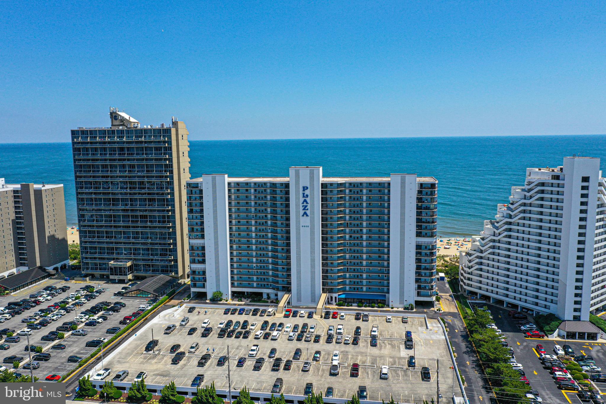 Direct oceanfront two-bedroom plus den (which can serve as an additional sleeping area), two-bath condo at The Plaza — one of Ocean City’s most sought-after oceanfront buildings. Ideally located on the 6th floor, this unit offers incredible ocean and bay views. This unit has updated kitchen and bath granite countertops and new flooring.
The spacious living room features sliding glass doors that open to a private balcony with spectacular views of the Atlantic Ocean and beach. The oceanfront primary suite includes a large picture window and direct access to the private balcony. The second bedroom is located on the bayside, offering beautiful sunset views.
The Plaza offers outstanding amenities, including a seasonal heated outdoor pool, kiddie pool, tiki bar and grill, oceanfront restaurant, year-round indoor pool, hot tub, saunas, and 24/7 security. This condo also includes premium assigned parking conveniently located near the entrance.
An excellent investment opportunity, this property generates strong rental income, with several weeks already booked for summer 2026, providing immediate additional revenue.
