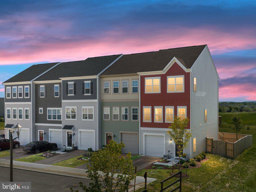 Exceptional views and on an ideal lot! Turn key ready home with some warranties still in place at this recently built townhome in 2025!

Offering over a little over 2,000 square feet of thoughtfully designed space, this home features three bedrooms, four bathrooms, and three fully finished levels. Enjoy the convenience of a one-car attached garage, along with a fenced backyard and a private rear deck—perfect for relaxing or entertaining.

Inside, you’ll find stylish finishes and numerous upgrades that create the perfect balance of comfort and functionality. The spacious primary suite includes a walk-in closet with a custom organizational system and a luxurious en-suite bath complete with a soaking tub, separate walk-in shower, and double vanities. Two additional bedrooms provide flexible space for family, guests, or a home office.

The open-concept main level offers a seamless flow, creating a bright and airy atmosphere ideal for everyday living. Perfectly positioned next to wooded views, the home also features a fully fenced yard with a newer privacy fence, deck stairs, and a durable composite and wood deck. Enjoy seeing the season colors change and summer fireworks right off your rear deck!

The lower level offers a spacious recreation room, a convenient half bath, and direct access to the rear yard—providing endless possibilities for a home gym, media room, play space, or additional living area.

Enjoy resort-style community amenities, including pools, walking trails, parks, and an indoor sports complex. Snowden Bridge also offers the convenience of an on-site elementary school and preschool/daycare. With easy access to commuter routes, shopping, and dining, this home truly has it all!

The land to the right side of the home is a protected turtle area and they should not be building homes right next to or directly behind the townhome. Buyer to verify all information and perform their own due diligence regarding the property.