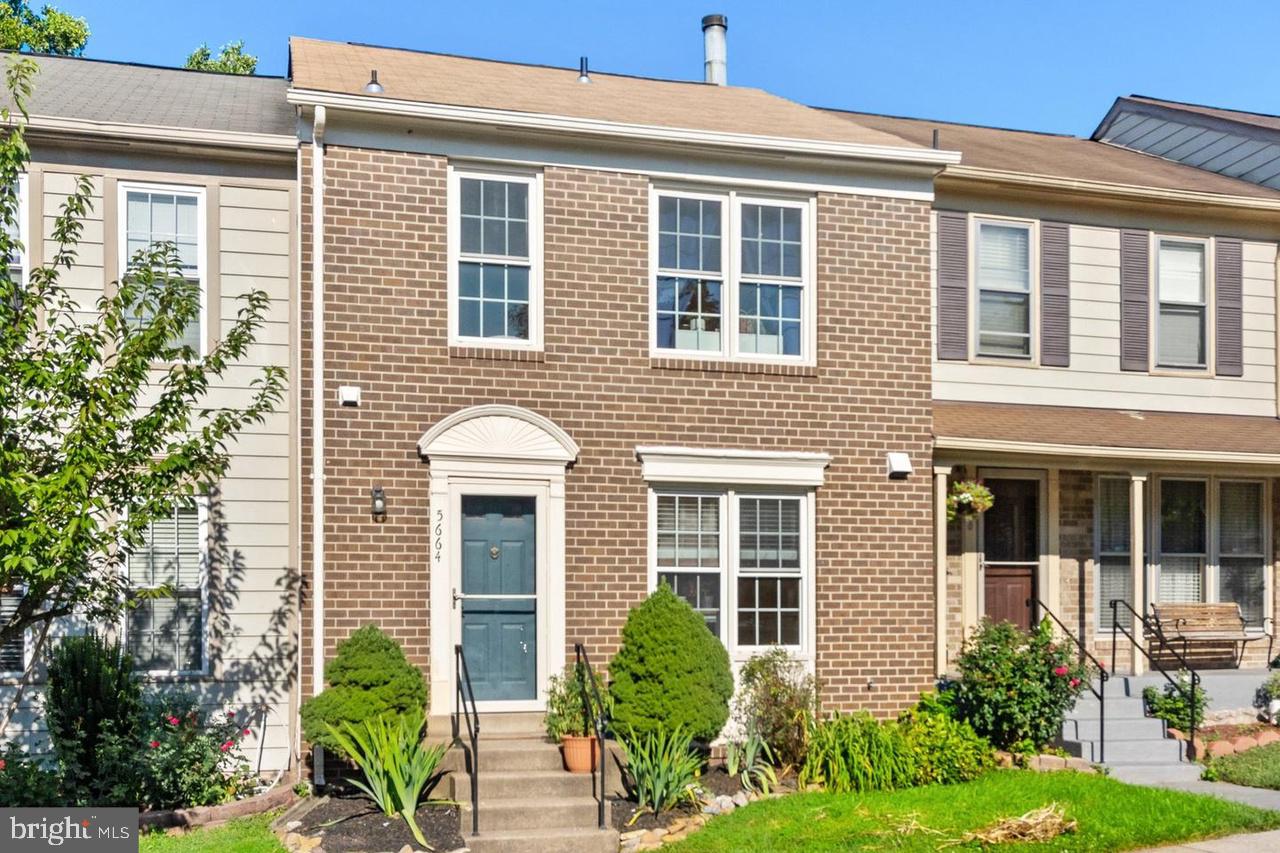 Welcome to this wonderful townhome with a walk-out basement in sought after Heritage Crossing! The open floor plan of the main level boasts hardwood floors, a half bath, and spacious eat-in kitchen. The hardwood floors continue to the upper level where you will find three large bedrooms and two full bathrooms (primary bathroom shower updated 2022). The fully finished lower level has a cozy wood burning fireplace, half bath, large storage area, and rare office/den. Enjoy entertaining outside on your expansive deck (2021) or lower level patio and fully fenced yard (2021). The property backs to a creek and has beautiful views of trees and walking trail. It is a perfect home for owning or renting. Plenty of walking trails, tot lot, and picnic areas. Pool membership available. Enjoy excellent commuter access and numerous nearby shopping and restaurants.