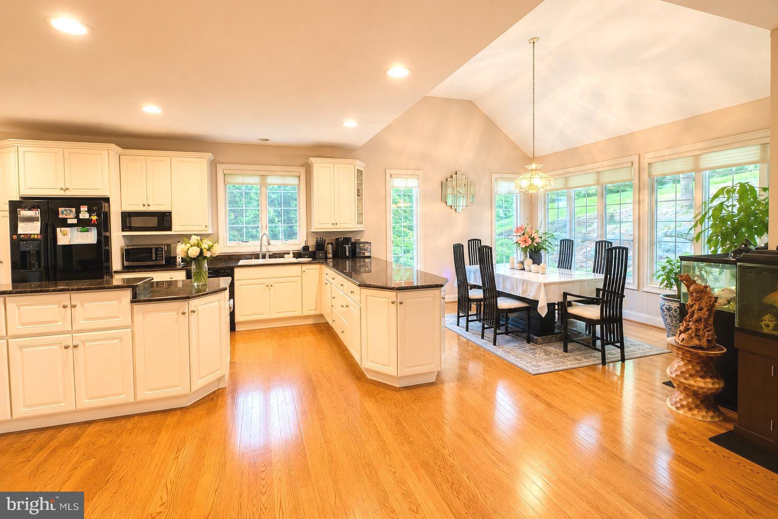 Elegant Luxury Living in Prestigious Stonewold. Welcome to this beautifully maintained Fleetwood model, proudly offered by the current owner and nestled on a professionally landscaped lot backing to private open space in the highly desirable Stonewold community. One of the largest models in the neighborhood, this exceptional home offers approximately 5,675 square feet of beautifully finished living space with 5-6 bedrooms, 4.5 baths, and a side-entry 3-car garage. Designed for both comfortable everyday living and elegant entertaining, this home showcases timeless style, quality craftsmanship, and thoughtful upgrades throughout. 

Recent Major Updates and Improvements: 
New Roof (May 2023)
New First-Zone HVAC System (April 2022)
New Second-Zone HVAC System (June 2020)
New Water Softener (April 2023)
New Hot Water (May 2019)

Step inside the dramatic two-story foyer with a graceful turned staircase, 9-foot ceilings throughout the first floor, and beautiful hardwood floors throughout the foyer, living room, dining room, kitchen, breakfast nook and family room. The sun-filled formal living and dining rooms feature elegant crown molding and oversized windows, creating warm and inviting spaces for entertaining. The gourmet kitchen features 42-inch cabinetry, granite countertops, a center island with a gas cooktop, double wall ovens, microwave, and a bright breakfast area. The spectacular two-story family room offers a gas fireplace, soaring windows, and a convenient rear staircase. A private study, updated powder room, and spacious laundry room complete the main level. Upstairs, the luxurious primary suite offers French doors, a spacious sitting room, and a beautifully renovated spa bath with a Jacuzzi tub, rainfall shower, quartz double vanity, and custom walk-in closets. A private Princess Suite includes its own full bath, while two additional generously sized bedrooms share a hall bath. The upstairs has 4 large beautiful bedrooms with 3 full bathrooms.

The finished lower level is perfect for entertaining or multigenerational living, featuring a spacious recreation room, media area, full kitchen with wet bar, custom cabinetry, wine refrigerator, exercise room, abundant storage, and a private in-law suite with a bedroom and full bath. The maintenance-free composite deck overlooks a beautiful, private backyard backing to open space, providing the perfect setting for outdoor entertaining or peaceful relaxation. For added peace of mind, an invasive stucco inspection was completed by Nick Hindley of Environspec, Ltd., and all recommended repairs have been professionally completed. Some documentation is available upon request. Lovingly maintained by its current owner and thoughtfully updated throughout, this exceptional home offers the perfect blend of luxury, comfort, and functionality in one of the area's most sought-after communities. A rare opportunity to own one of Stonewold's finest homes.