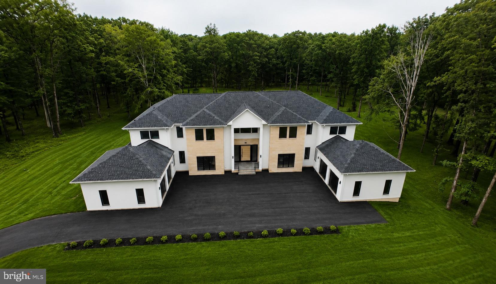 Situated on one of the most iconic streets in Clifton, this stunning custom built estate offers over 13,000 sqft of exceptional living space and an expansive 4 car garage***Nestled on more than 5 beautiful wooded acres, this extraordinary residence is a true homeowners dream***Meticulously crafted with timeless design, luxurious finishes, unparalleled attention to detail, this masterpiece seamlessly blends elegance, comfort and privacy***The thoughtfully designed main level is highlighted by a breathtaking 2 story family room with natural light, an exquisite gourmet kitchen adorned with custom cabinetry and high end finishes, and a luxurious main level owners retreat featuring an expansive walk in closet and a stunning spa inspired bath designed for ultimate comfort and relaxation***The upper level continues to impress with an additional expansive owners suite, a generously sized laundry room and 3 beautifully appointed en suite bedrooms, each offering exceptional comfort, privacy and refined finishes throughout***Designed with entertainment in mind, the fully finished lower level offers an exceptional blend of luxury and functionality, featuring an expansive theatre room, a private guest suite with a walk in closet and full bath, and a dedicated fitness area perfect for everyday wellness and recreation***Offering the perfect balance of luxury, comfort and privacy, this extraordinary estate presents a rare opportunity to own one of Cliftons most exceptional residences