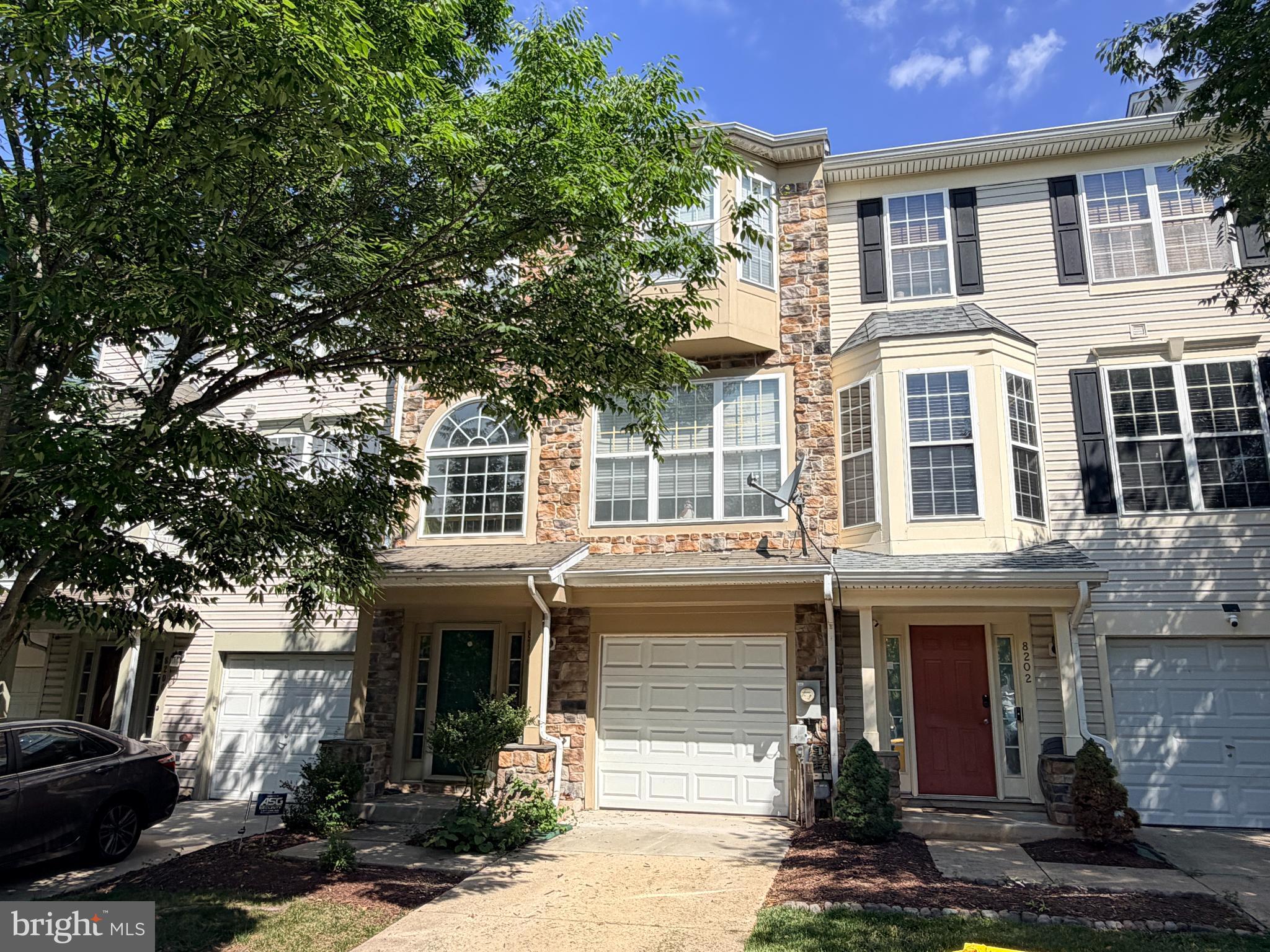 Professional photography will be uploaded Saturday July 25. 
YOU CAN BE CLOSED & SETTLED IN YOUR NEW HOME IN TIME FOR THE NEW SCHOOL YEAR!  This is an opportunity your don't want to miss!  From the moment you arrive, you'll appreciate how meticulously maintained and thoughtfully updated this beautiful STONE FRONT townhome truly is.  Offering 3 bedrooms, 2.5 baths, a 1-car garage, and additional driveway parking, this home is PACKED WITH UPGRADES you'll enjoy from day one.  The garage features a custom GARAGE TEK organization system, making storage a breeze.  Major improvements include a BRAND NEW ROOF (July 2026), BRAND NEW interior paint (July 2026), NEW carpeting in the family room, a brand-new front entry door (2026), a new garage to foyer entry door (2026), a HIGH EFFICIENCY Lennox heating and air conditioning system (2013), and a NEW thermostat (2024).  Both sliding doors at the rear of the home were replaced in 2011.  One of the home's most UNIQUE FEATURES is the installation of three Solatube® daylighting systems, bringing beautiful natural daylight and even soft moonlight after dark into the stairwell, primary bedroom walk-in closet, and upper-level hall bath.  It's a feature you simply don't see every day and one you'll appreciate year-round.  Step inside to a welcoming foyer with ceramic tile flooring.  The entry-level family room offers brand-new carpeting, recessed lighting, a laundry closet, and a rough-in for a future half bath-for now you can utilize the space as additional storage.  A door provides easy access to the backyard.  The main living level showcases GLEAMING BRAZILIAN OAK HARDWOOD FLOORING throughout most of the level—WOW!  The updated kitchen is sure to impress with STAINLESS STEEL APPLIANCES, QUARTZ COUNTERTOPS, ample cabinet space, and a sunny breakfast area finished with ceramic tile flooring.  The adjoining living and dining rooms create an inviting OPEN-CONCEPT LAYOUT centered around a stunning THREE-SIDED GAS FIREPLACE, making it the perfect space for entertaining family and friends.  A convenient half bath completes the main level.  Step outside onto the rear deck and imagine weekend cookouts, relaxing with your morning coffee, or winding down under the stars after a long day.  The upper level features a PRIVATE PRIMARY BEDROOM SUITE with a SOARING VAULTED CEILING, ceiling fan, walk-in closet with custom organization system, and a private luxury bath complete with a DEEP SOAKING TUB, separate shower, dual-sink quartz vanity, and ceramic tile flooring.  Bedrooms two and three both feature dramatic vaulted ceilings, while bedroom 2 is enhanced by a charming bay window that fills the room with natural light.  The hall bath has also been updated with ceramic tile flooring and a quartz vanity.  The entire upper level is also finished with BRAZILIAN OAK HARDWOOD FLOORING!  With fresh updates throughout, abundant natural light, QUALITY IMPROVEMENTS ALREADY COMPLETED and nothing left to do but move in, this exceptional home offers the perfect combination of comfort, style, and convenience.  Russett residents enjoy an active homeowners’ association with outstanding amenities, including multiple swimming pools, tennis and pickleball courts, bike, jog, and walking paths, volleyball and basketball courts, picnic areas, tot lots, and so much more.  The highly regarded and tremendously desirable Russett community is strategically located between Baltimore and Washington, DC, offering exceptional convenience.  Just minutes from Fort Meade, NSA, APL, major commuter routes, the Laurel MARC–Camden Line train station, shopping, dining, historic Laurel, and BWI Airport.  Everything you need is right here waiting for you!  All information deemed accurate but not guaranteed.