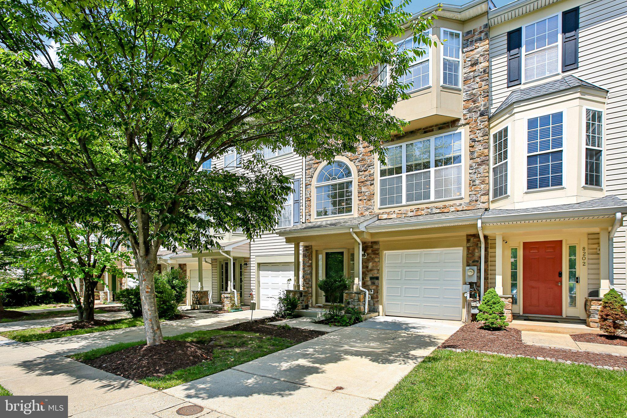 YOU CAN BE CLOSED & SETTLED IN YOUR NEW HOME IN TIME FOR THE NEW SCHOOL YEAR!  This is an opportunity your don't want to miss!  From the moment you arrive, you'll appreciate how meticulously maintained and thoughtfully updated this beautiful STONE FRONT townhome truly is.  Offering 3 bedrooms, 2.5 baths, a 1-car garage, and additional driveway parking, this home is PACKED WITH UPGRADES you'll enjoy from day one.  The garage features a custom GARAGE TEK organization system, making storage a breeze.  Major improvements include a BRAND NEW ROOF (July 2026), BRAND NEW interior paint (July 2026), NEW carpeting in the family room, a brand-new front entry door (2026), a new garage to foyer entry door (2026), a HIGH EFFICIENCY Lennox heating and air conditioning system (2013), and a NEW thermostat (2024).  Both sliding doors at the rear of the home were replaced in 2011.  One of the home's most UNIQUE FEATURES is the installation of three Solatube® daylighting systems, bringing beautiful natural daylight and even soft moonlight after dark into the stairwell, primary bedroom walk-in closet, and upper-level hall bath.  It's a feature you simply don't see every day and one you'll appreciate year-round.  Step inside to a welcoming foyer with ceramic tile flooring.  The entry-level family room offers brand-new carpeting, recessed lighting, a laundry closet, and a rough-in for a future half bath-for now you can utilize the space as additional storage.  A door provides easy access to the backyard.  The main living level showcases GLEAMING BRAZILIAN OAK HARDWOOD FLOORING throughout most of the level—WOW!  The updated kitchen is sure to impress with STAINLESS STEEL APPLIANCES, QUARTZ COUNTERTOPS, ample cabinet space, and a sunny breakfast area finished with ceramic tile flooring.  The adjoining living and dining rooms create an inviting OPEN-CONCEPT LAYOUT centered around a stunning THREE-SIDED GAS FIREPLACE, making it the perfect space for entertaining family and friends.  A convenient half bath completes the main level.  Step outside onto the rear deck and imagine weekend cookouts, relaxing with your morning coffee, or winding down under the stars after a long day.  The upper level features a PRIVATE PRIMARY BEDROOM SUITE with a SOARING VAULTED CEILING, ceiling fan, walk-in closet with custom organization system, and a private luxury bath complete with a DEEP SOAKING TUB, separate shower, dual-sink quartz vanity, and ceramic tile flooring.  Bedrooms two and three both feature dramatic vaulted ceilings, while bedroom 2 is enhanced by a charming bay window that fills the room with natural light.  The hall bath has also been updated with ceramic tile flooring and a quartz vanity.  The entire upper level is also finished with BRAZILIAN OAK HARDWOOD FLOORING!  With fresh updates throughout, abundant natural light, QUALITY IMPROVEMENTS ALREADY COMPLETED and nothing left to do but move in, this exceptional home offers the perfect combination of comfort, style, and convenience.  Russett residents enjoy an active homeowners’ association with outstanding amenities, including multiple swimming pools, tennis and pickleball courts, bike, jog, and walking paths, volleyball and basketball courts, picnic areas, tot lots, and so much more.  The highly regarded and tremendously desirable Russett community is strategically located between Baltimore and Washington, DC, offering exceptional convenience.  Just minutes from Fort Meade, NSA, APL, major commuter routes, the Laurel MARC–Camden Line train station, shopping, dining, historic Laurel, and BWI Airport.  Everything you need is right here waiting for you!  All information deemed accurate but not guaranteed.