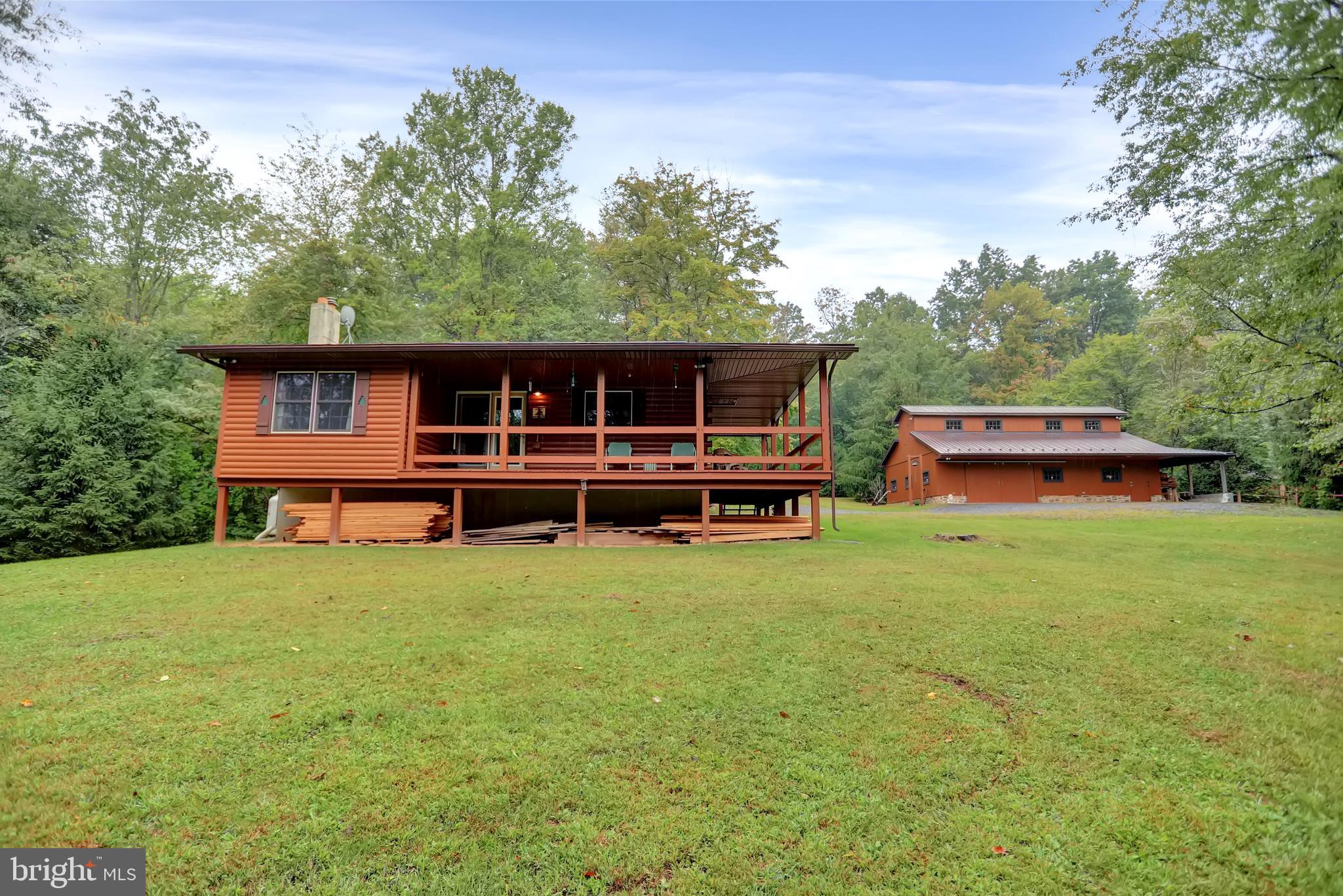 Charming Shade Gap Getaway/second home on 5.28 acres located in a quiet & secluded Locke Valley Subdivision in Huntingdon County. Includes log cabin & a two-story 28' X 42' Amish built mortise and tenon hemlock garage/barn, with a 10' lean-to. 16' X 16' metal utility shed. State game land #81 nearby. The home includes multiple heat sources (Propane, Wood and 2 mini splits), Newer architectural shingled roof, LR cathedral ceiling with gas log stove. 2 bedrooms but could easily be converted to 3 bedrooms. Partially finished 22' X 29' basement. Utility and laundry in basement. Overall, this property is very well kept and provides a peaceful retreat with its scenic surroundings, ample storage space. Additional land & small cabin available. 10 min. from the historical East Broad Top Railroad, 40 mins. from multiple Lake Raystown access points. 1hr. 25 mins. from Harrisburg & State College. 1hr. 55 mins. from Lancaster. 2 1/2 hrs. from Baltimore & Pittsburgh. More pictures to follow.