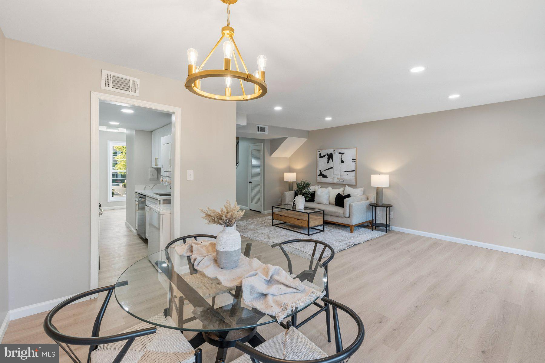 Welcome home to this beautifully renovated 3-bedroom, 2.5-bath townhome-style condominium in the desirable Woodside Village community. Thoughtfully updated from top to bottom, this move-in-ready home features modern finishes, brand-new flooring and carpet, stylish fixtures, and a bright open layout designed for today's lifestyle. The updated kitchen showcases elegant quartz countertops, contemporary cabinetry, and ample prep space, while the oversized windows and expansive balcony door flood the home with natural light throughout the day. Enjoy seamless indoor-outdoor living with direct access to the private balcony—perfect for morning coffee or unwinding after a long day. Convenience abounds with an in-unit washer and dryer, generous bedroom sizes, and updated baths. The condo fee includes utilities, helping simplify monthly expenses and add value for homeowners and investors alike.

Ideally located just minutes from Metro access, major commuter routes, shopping, dining, and downtown Silver Spring, this home offers the perfect combination of modern comfort, convenience, and long-term value. Whether you're searching for your next home or a smart investment opportunity, this turnkey property is one you won't want to miss.