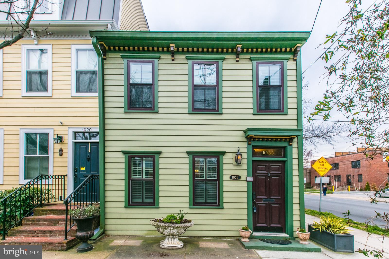 JUST SOUTH OF AMAZON HQ2 - A MUST SEE! SUN FILLED, CHARMING OLDE TOWNE ALEXANDRIA TOWNEHOUSE - END UNIT. Centrally located in the heart of Old Town Alexandria. Beautifully remodeled historic home features 3 Bedrooms, 2.5  bathrooms, WALK - IN CLOSETS and OFF-STREET PARKING.  Beautiful antique mantle adorns the fireplace (not functional) in the living room with old plank hardwood floors. Large dining room and open concept remodeled kitchen and powder room complete the main level. Master bedroom features a renovated En-suite bathroom with Antique Barn Doors, Walk-In Closet and spacious shower.  Bedrooms 2 and 3 share a renovated Jack and Jill bathroom.  Laundry on bedroom level! Charming private, fenced courtyard with a Wisteria covered gazebo. Off street parking behind in alley. Walk to metro, bus stop, Olde Towne shopping, restaurants, galleries and night life.