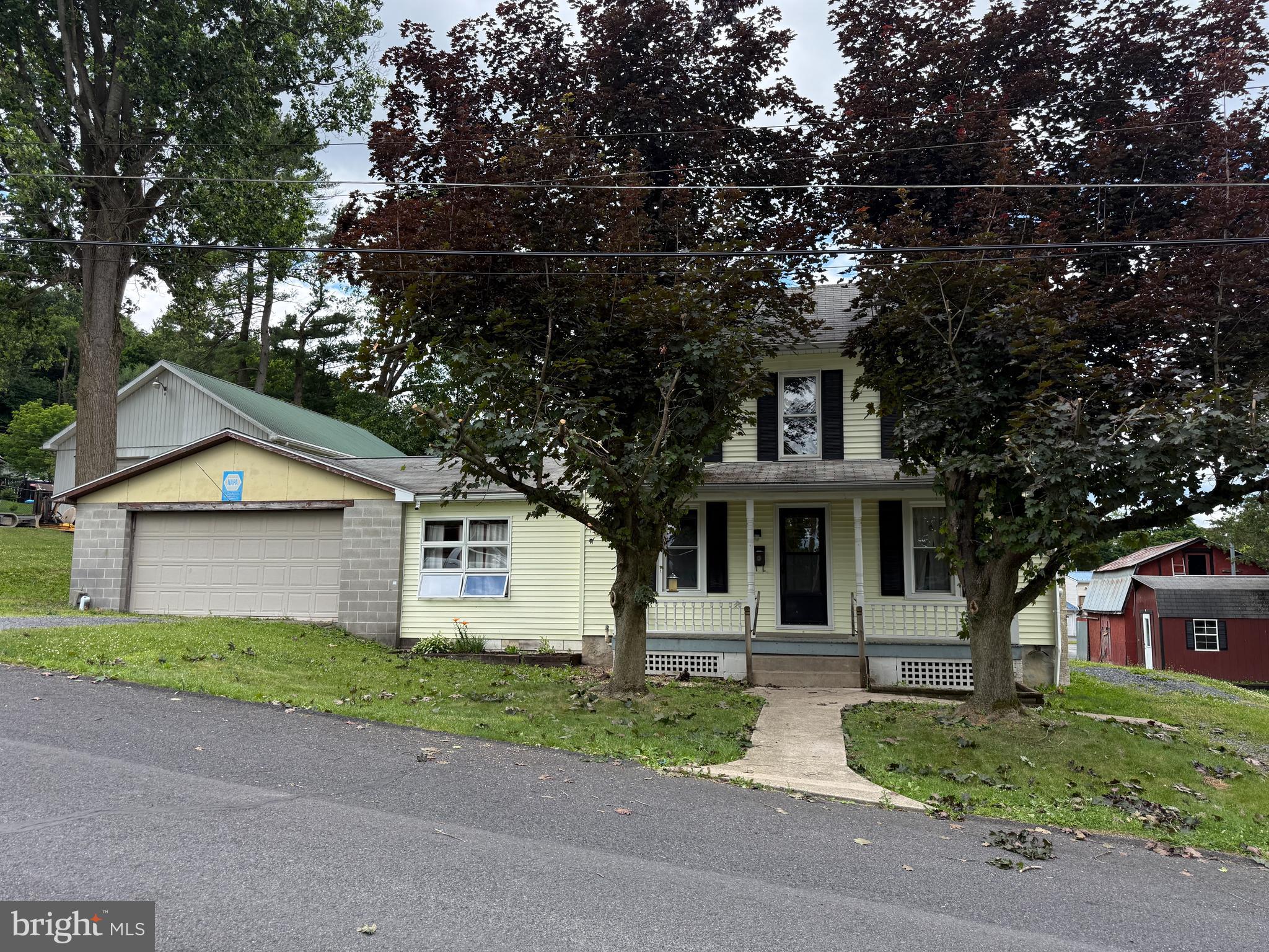 This 2-story, 3-bedroom home sits on nearly a half-acre. The home has a 24x24 attached garage that enters into the large 12x22 family room.  In addition to the family room, the main level also has a living room with a wood stove, eat-in kitchen, large half bathroom, and laundry. The second floor has 3 bedrooms and a full bathroom. The home has public water and sewer. The exterior was recently pressure washed and is ready for a new owner.